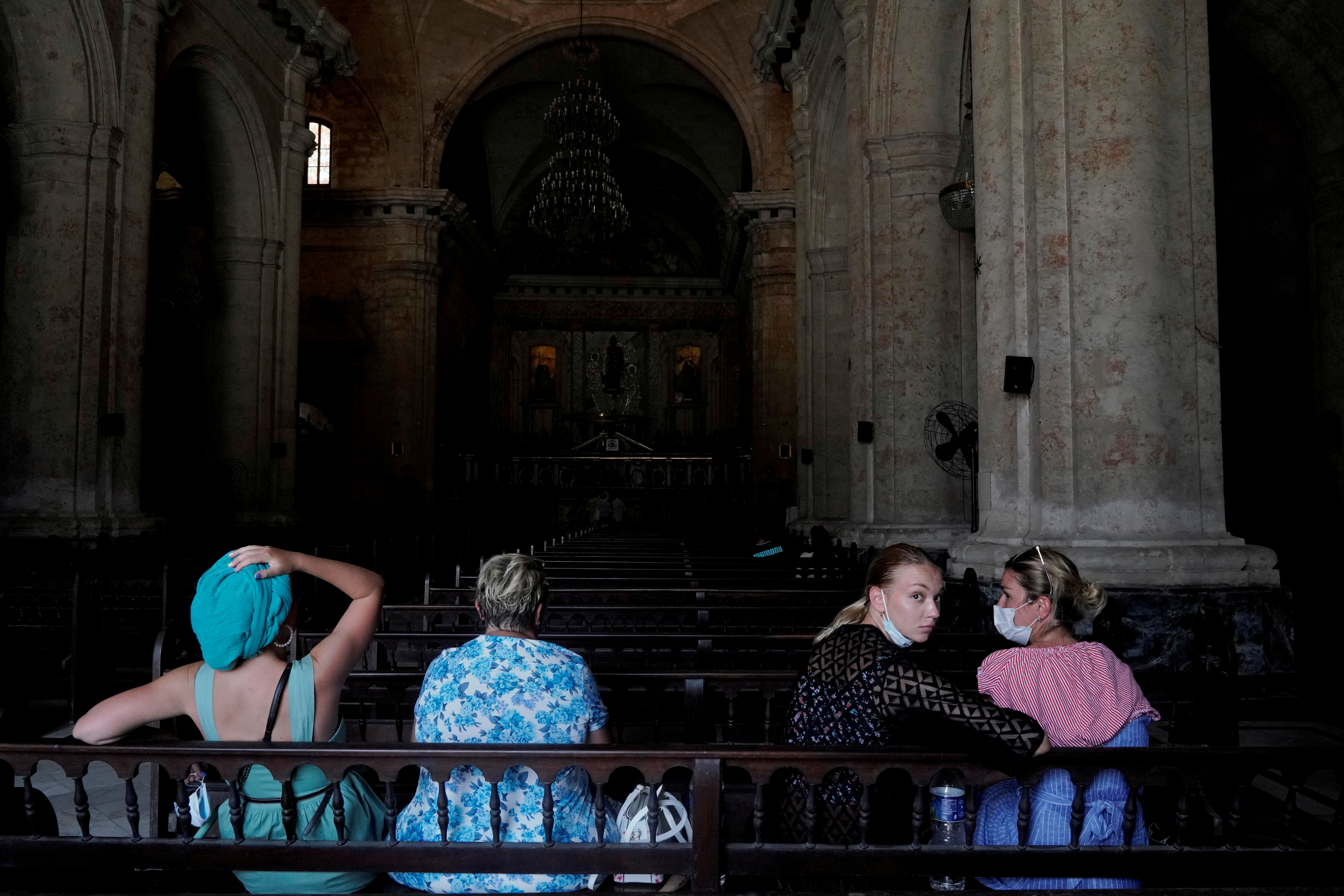 Tourists from Russia visit the Havana's Cathedral
