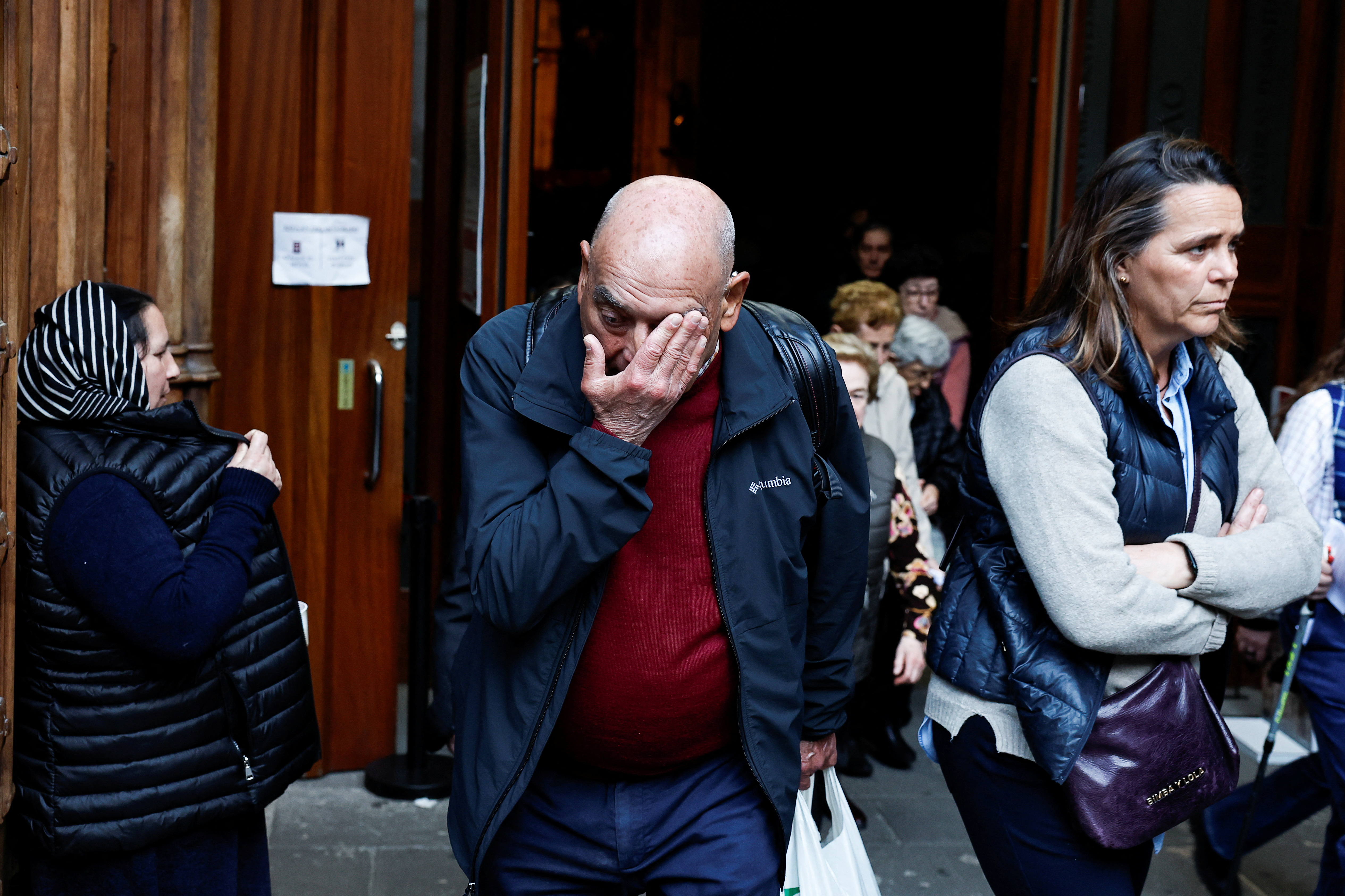 A man reacts on leaving a mass where forgiveness was asked for from victims of sexual abuse by the Catholic Church, in Bilbao