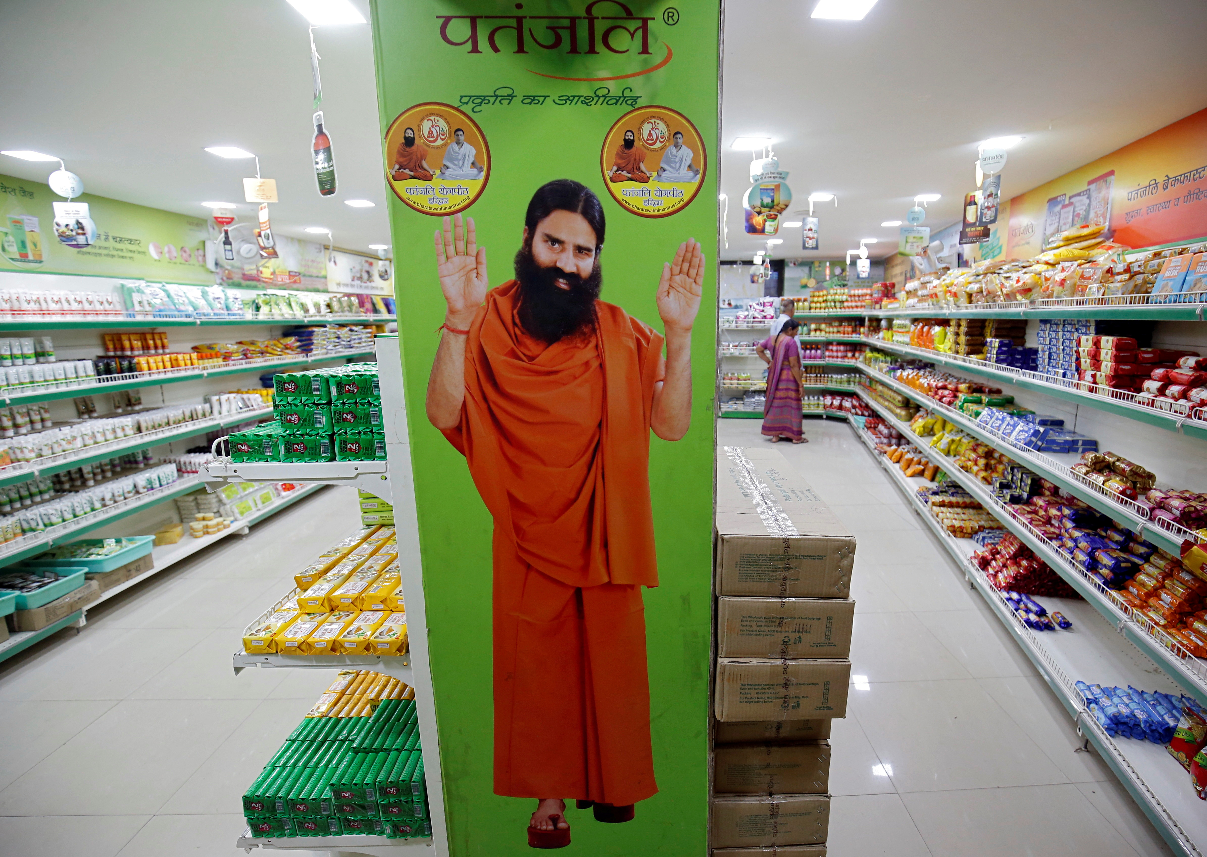 A hoarding with an image of Baba Ramdev is seen inside a Patanjali store in Ahmedabad