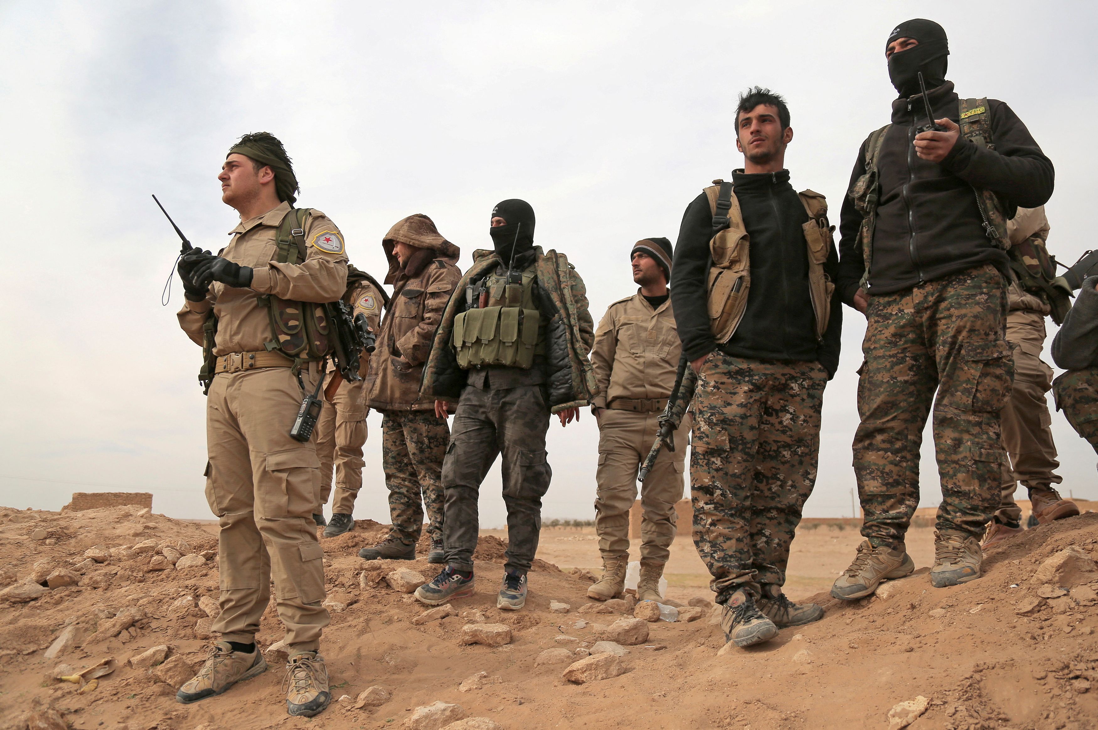 Syrian Democratic Forces (SDF) fighters gather during an offensive against Islamic State militants in northern Raqqa province
