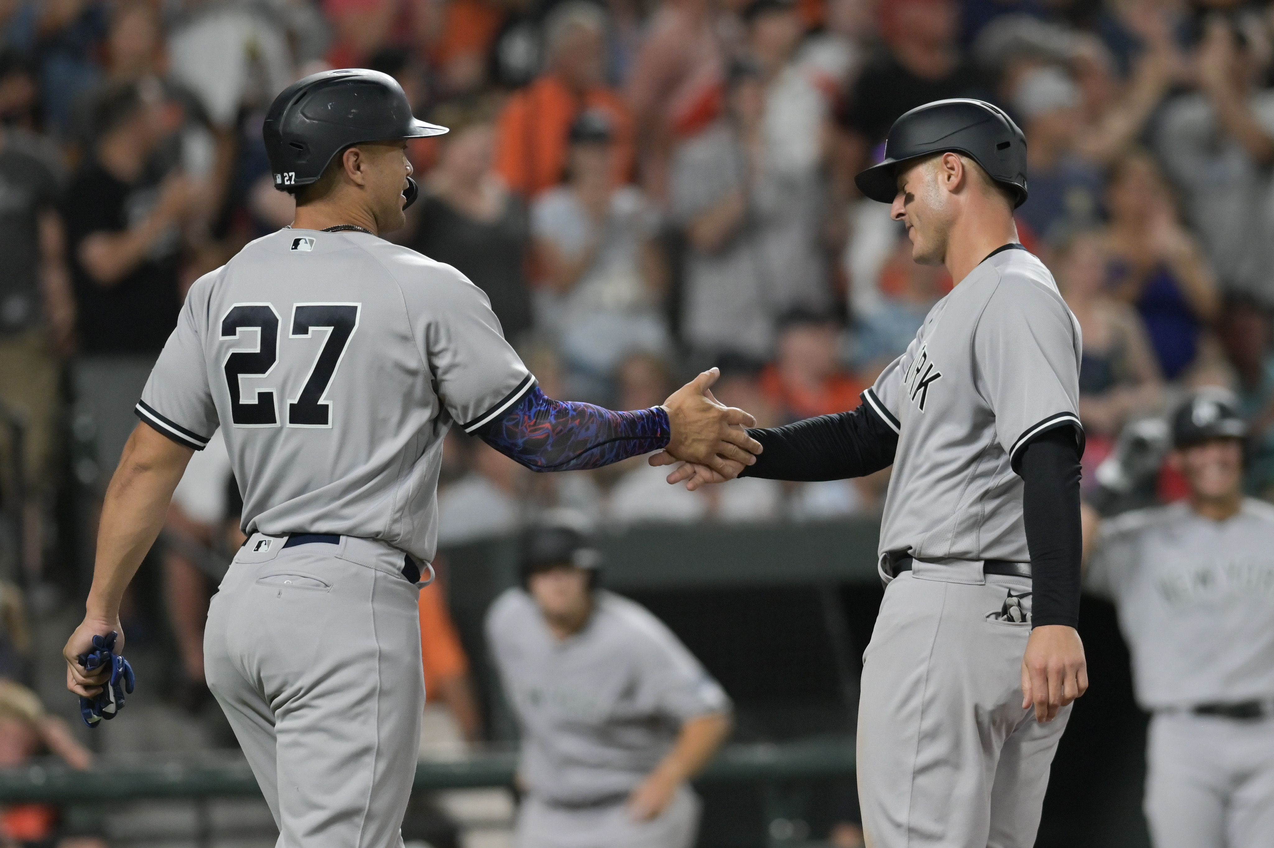 Dyersville, United States. 12th Aug, 2021. New York Yankees' Aaron Judge  (99) celebrates with Rougned Odor (12) after a three-run homer against the  Chicago White Sox during the third inning of the