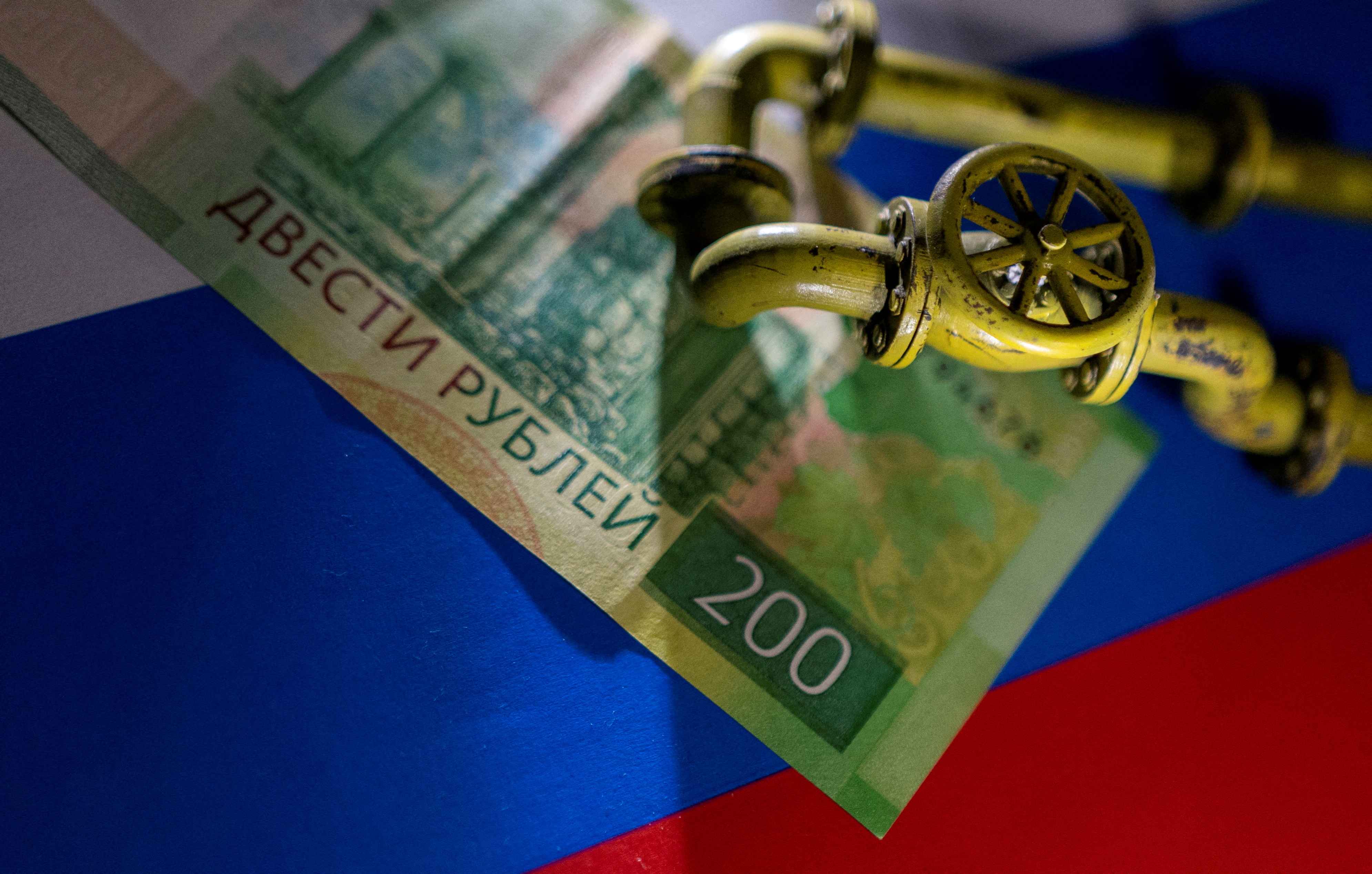 Illustration shows natural gas pipeline, Russian Rouble banknote and flag