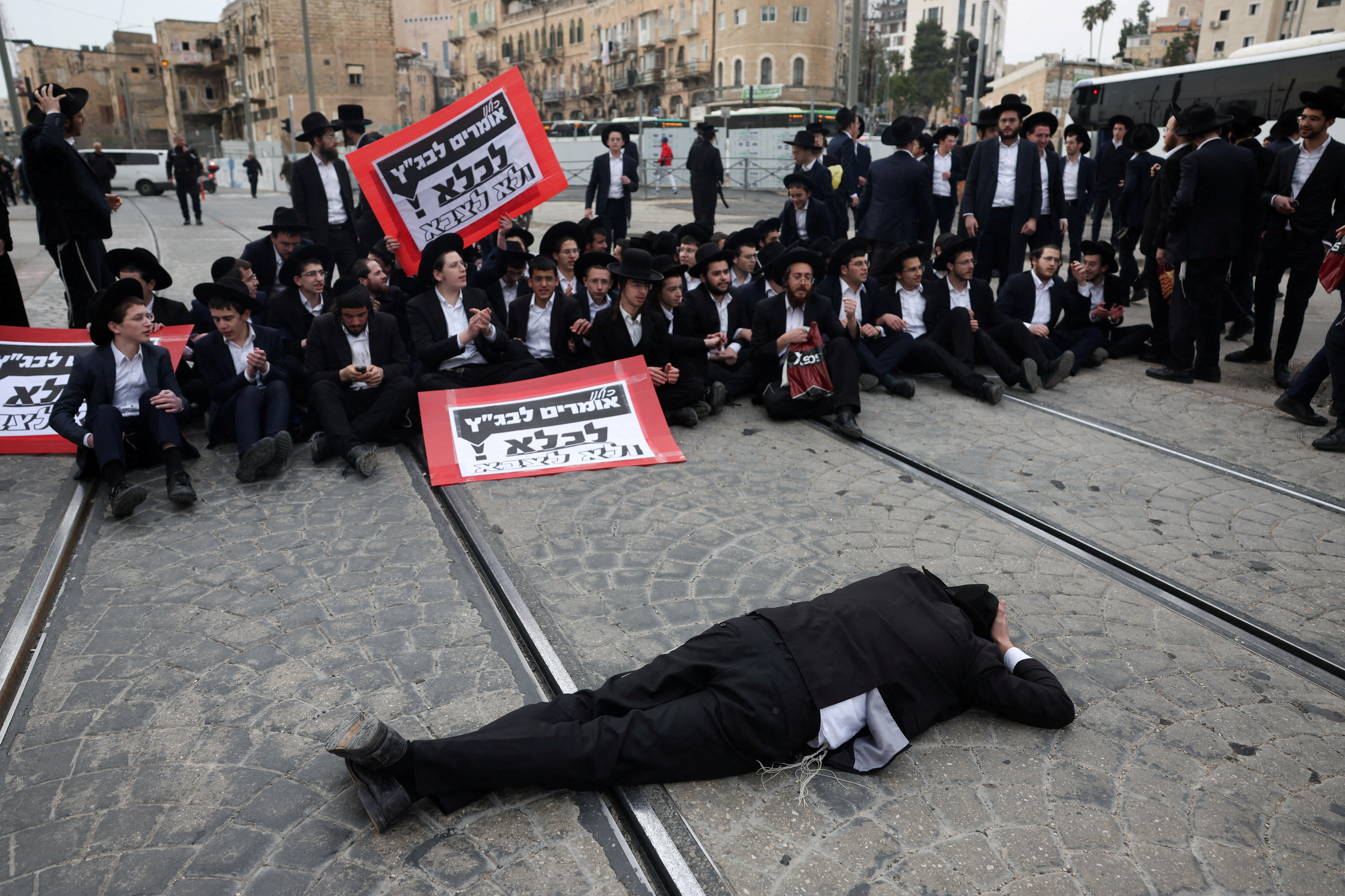 Ultra-Ortodox Jewish men protest against attempts to change government policy that grants ultra-Orthodox Jews exemptions from military conscription, in Jerusalem