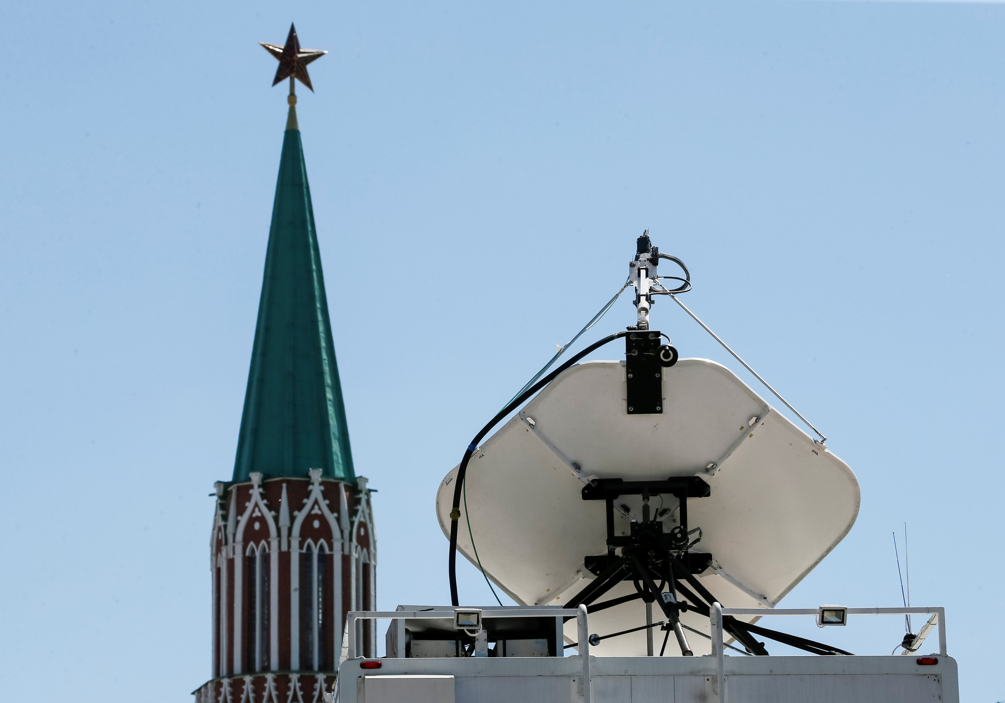 Vehicles of Russian state-controlled broadcaster Russia Today are seen near the Red Square in central Moscow