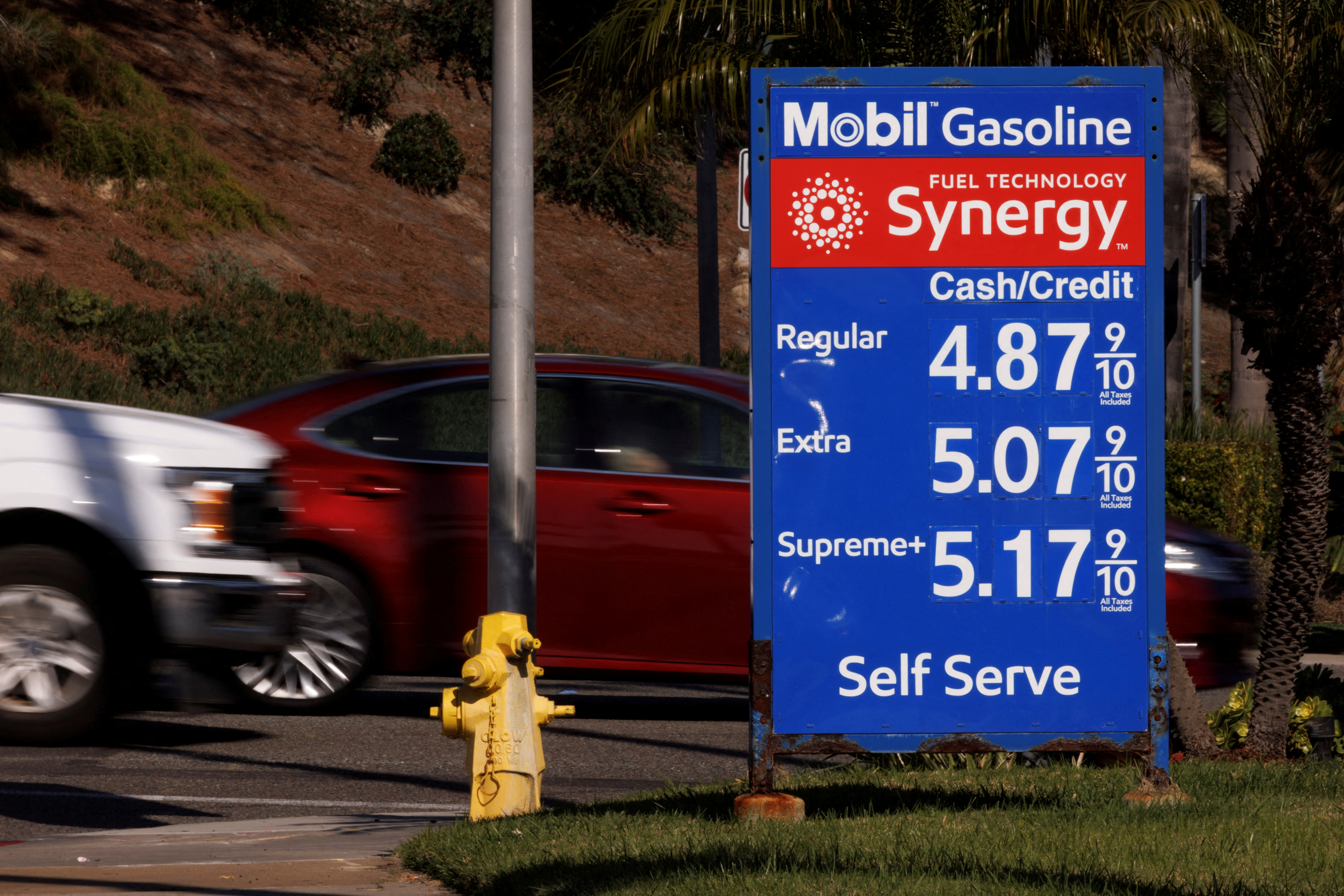 Gas prices grow along with inflation as this sign at a gas station shows in Solana Beach, California