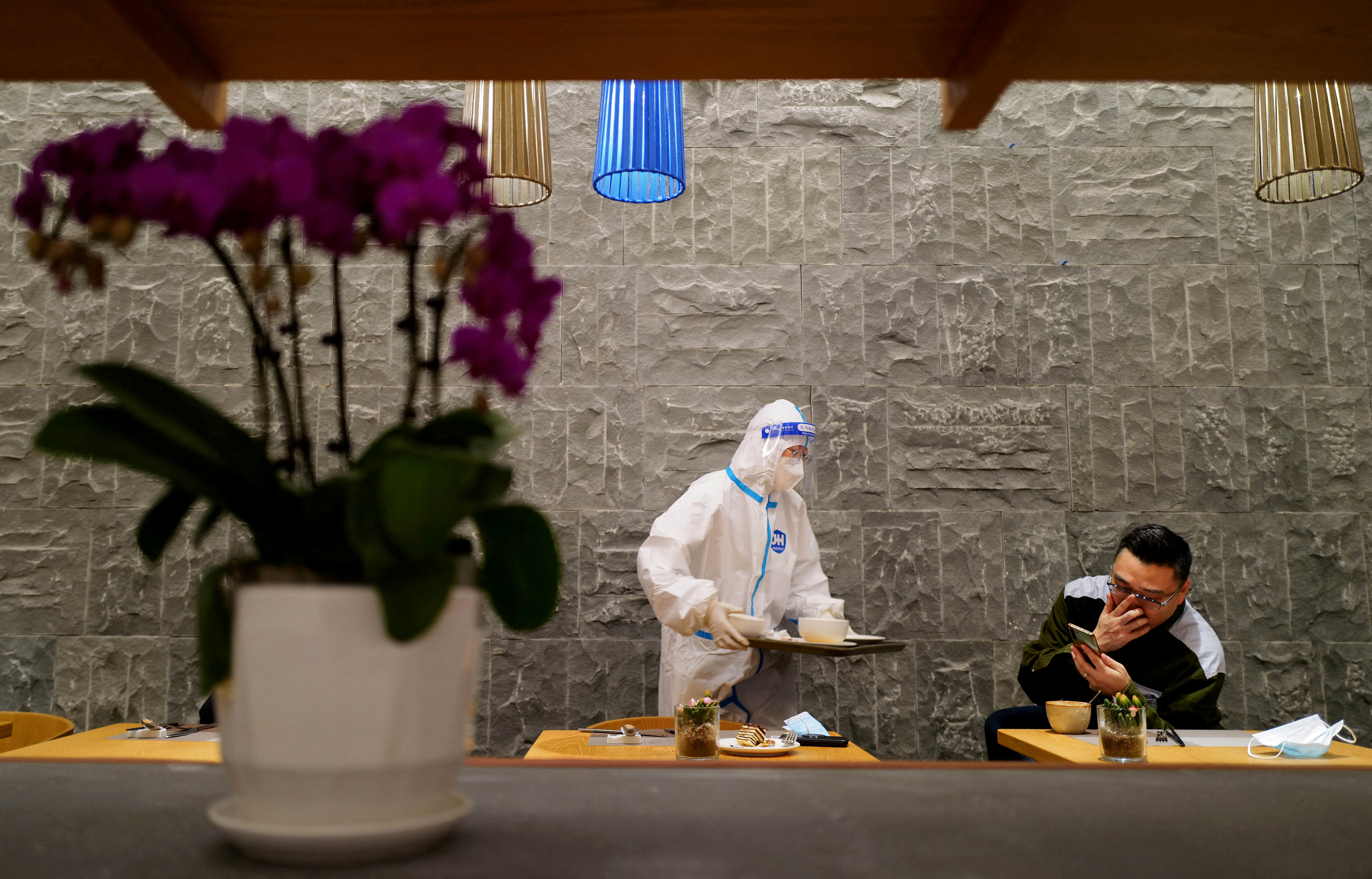 Waiter works inside a media hotel for the Beijing 2022 Winter Olympics in Zhangjiakou