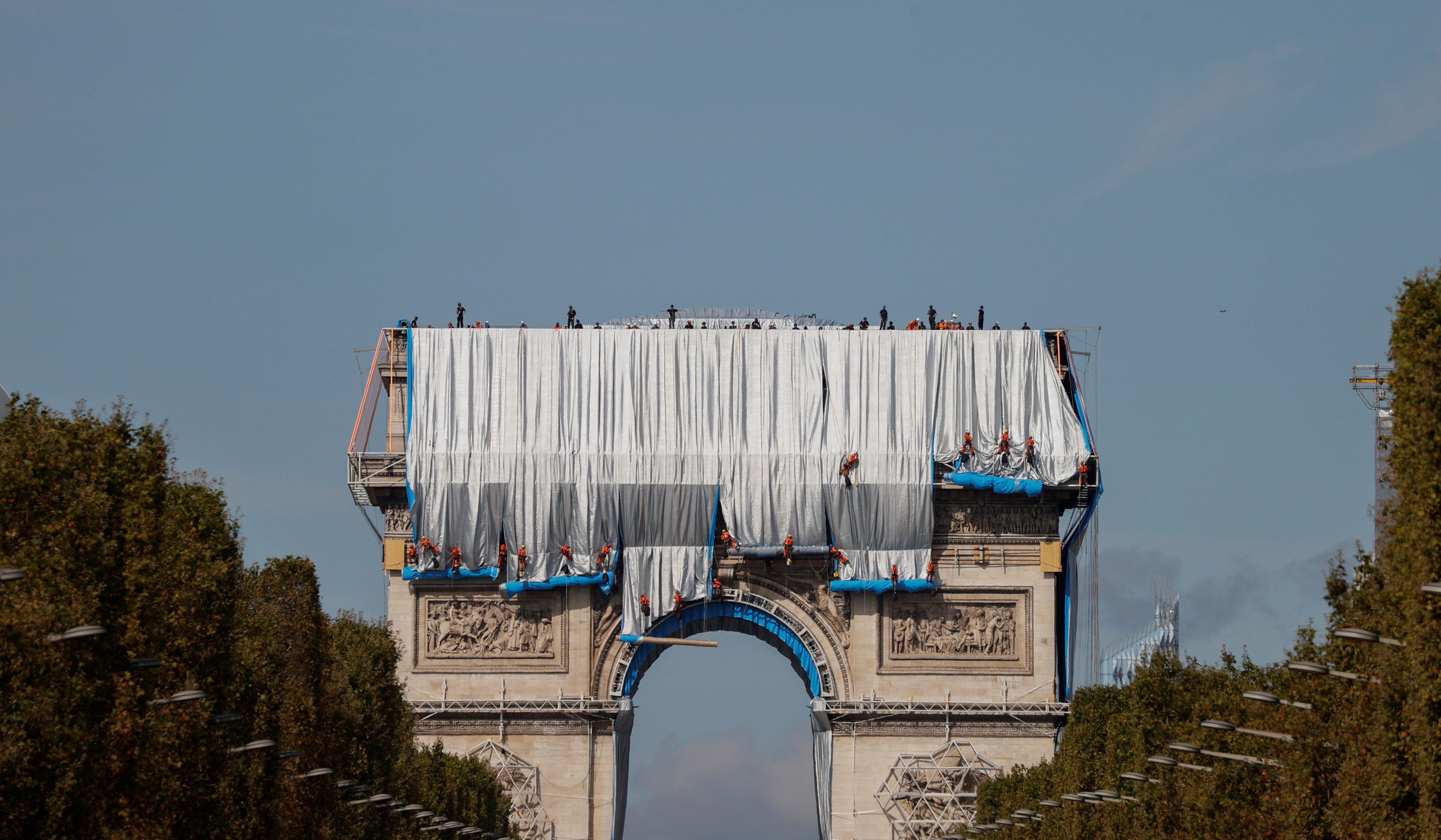 Arc de Triomphe enveloped by a shimmering wrapper in a posthumous installation by artist Christo