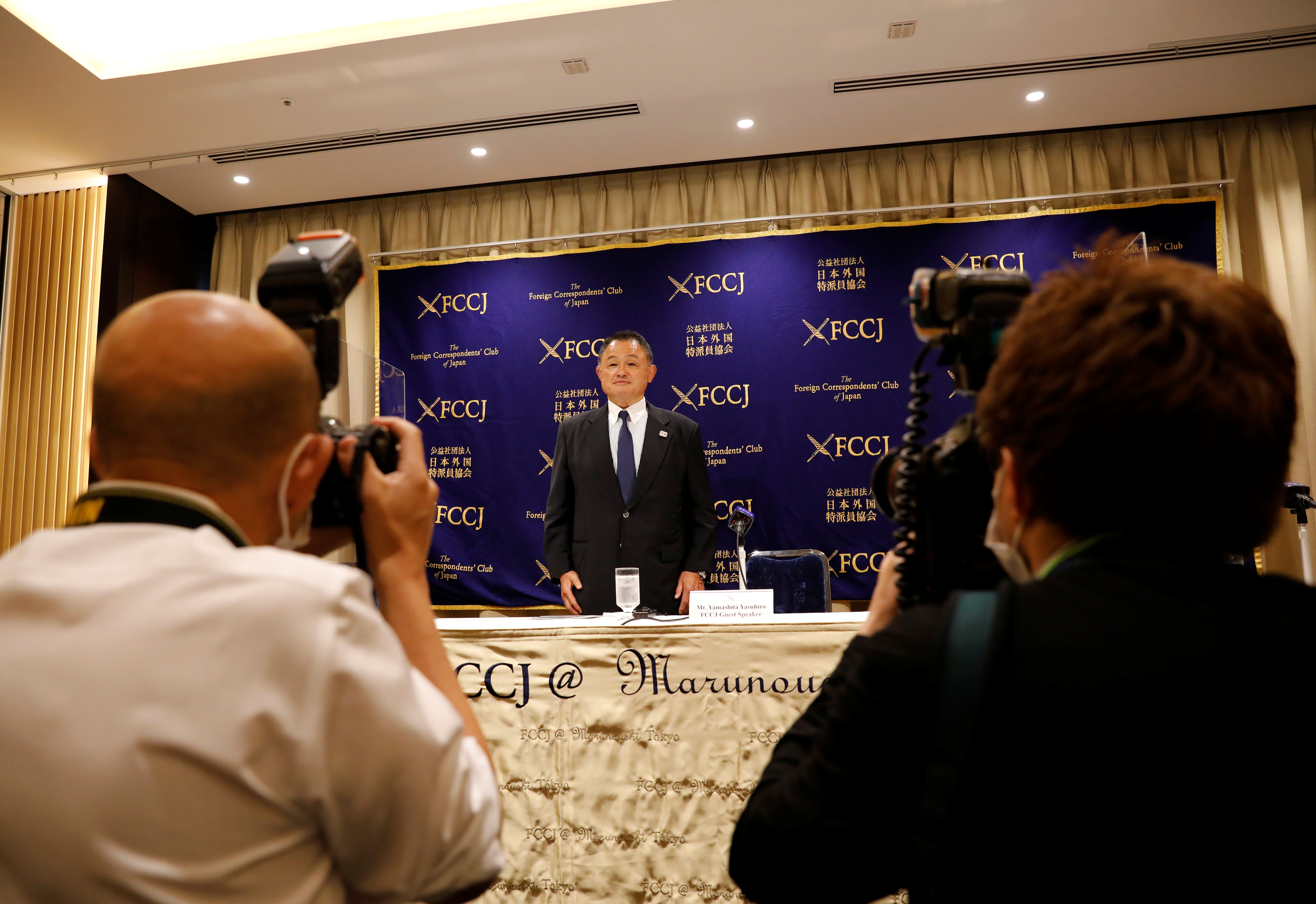 Japanese Olympic Committee President Yasuhiro Yamashita poses for photographers as he attends a news conference in Tokyo, Japan, June 28, 2021. REUTERS/Kim Kyung-Hoon