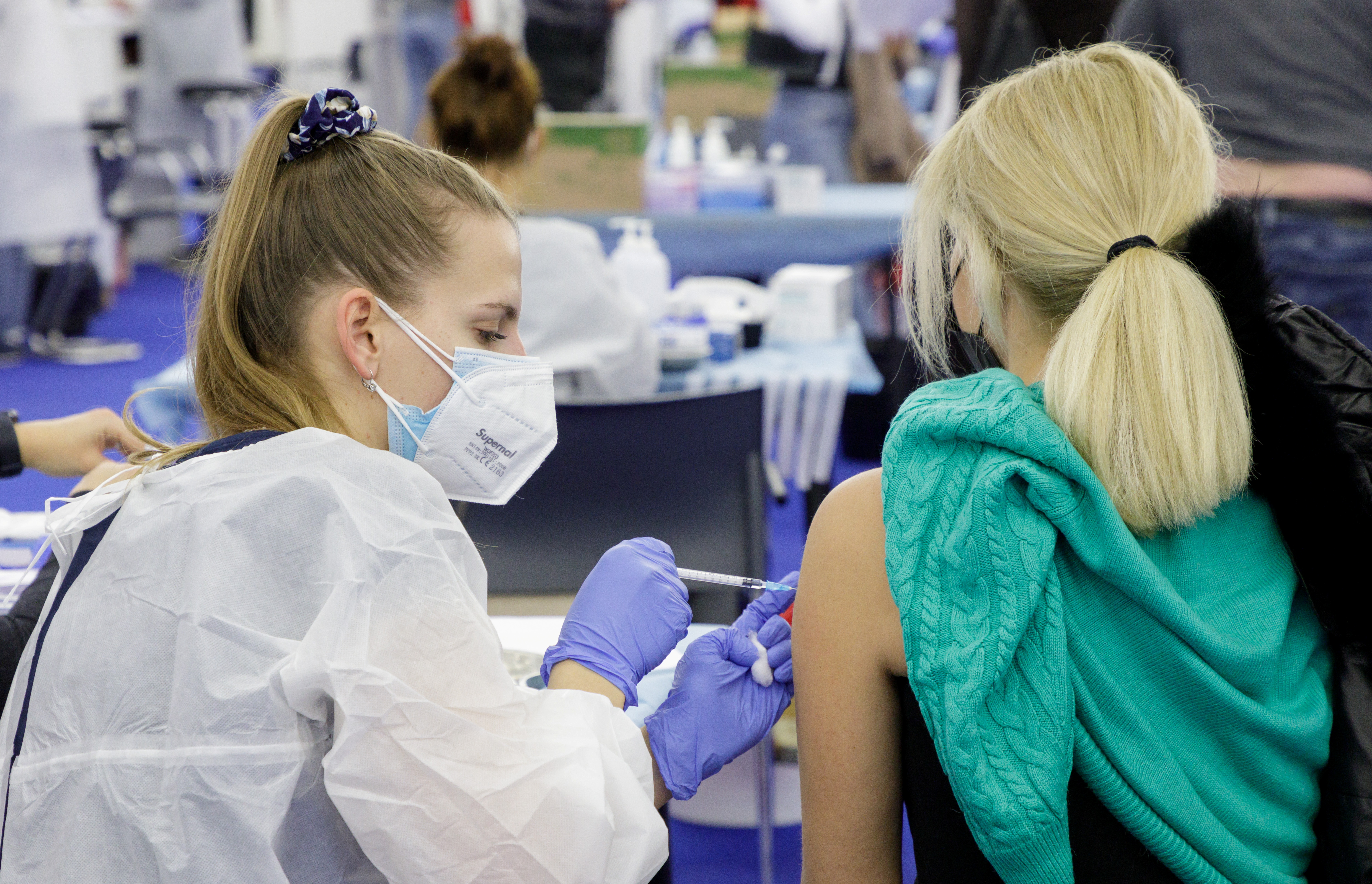 A woman receives a dose of the coronavirus disease (COVID-19) vaccine at a vaccination center in Zagreb, Croatia, November 15, 2021. REUTERS/Antonio Bronic