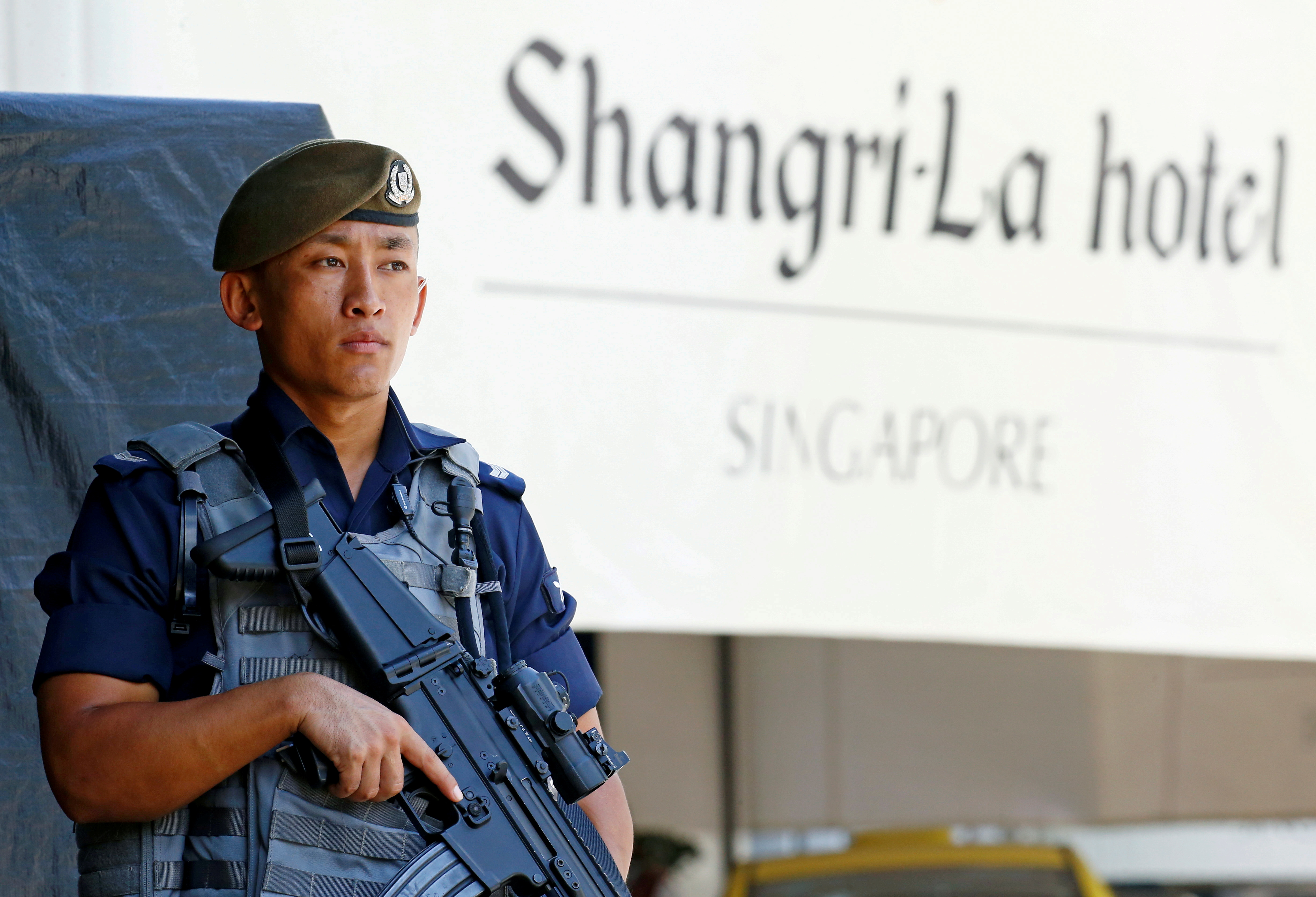 A Gurkha police officer stands guard outside the venue of the IISS Shangri-La Dialogue in Singapore