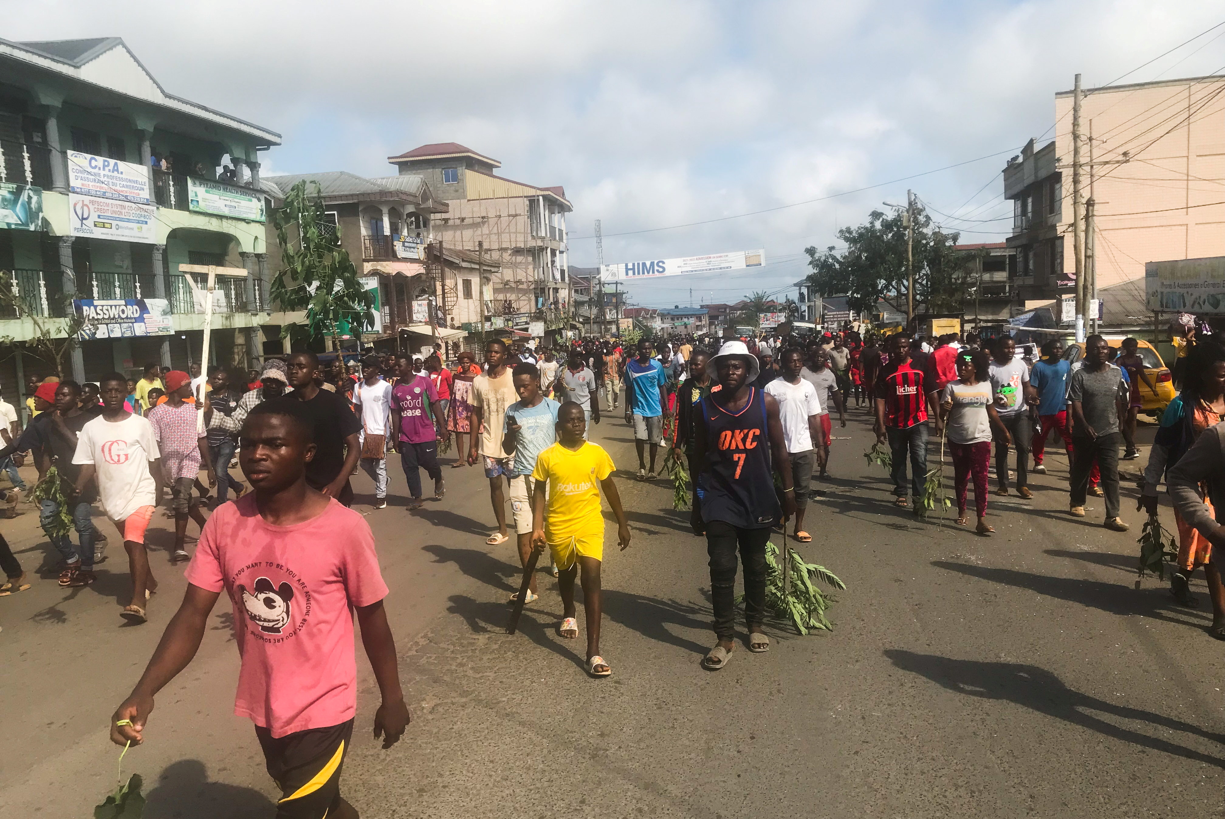 Residents protest through the streets after the killing of a a five-year-old girl by a military police officer in Buea, Cameroon