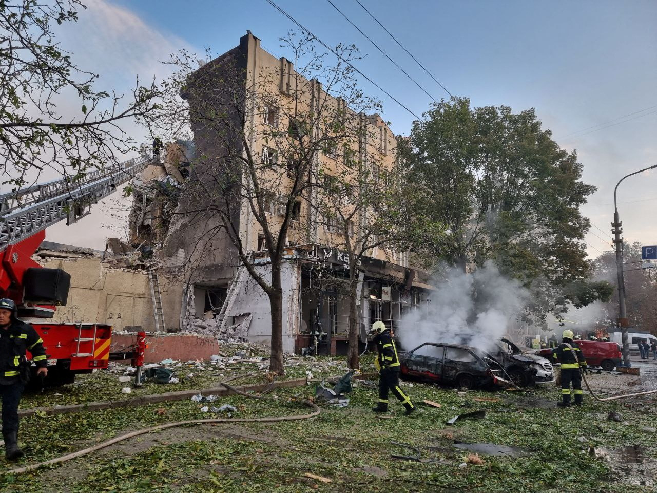 Emergency members work in the aftermath of a Russian military strike in the location given as Cherkasy