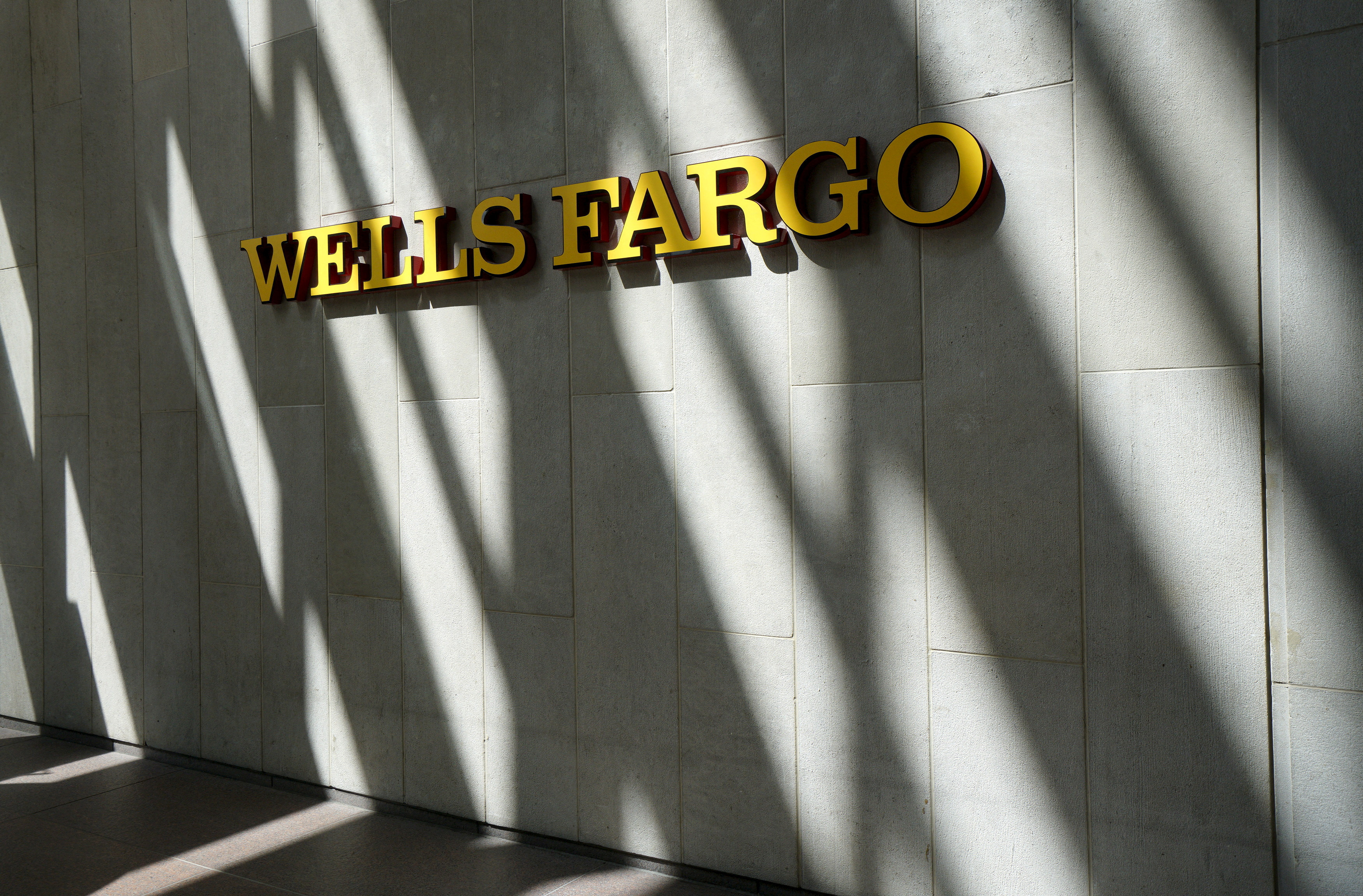 The sign outside the Wells Fargo & Co. bank in downtown Denver
