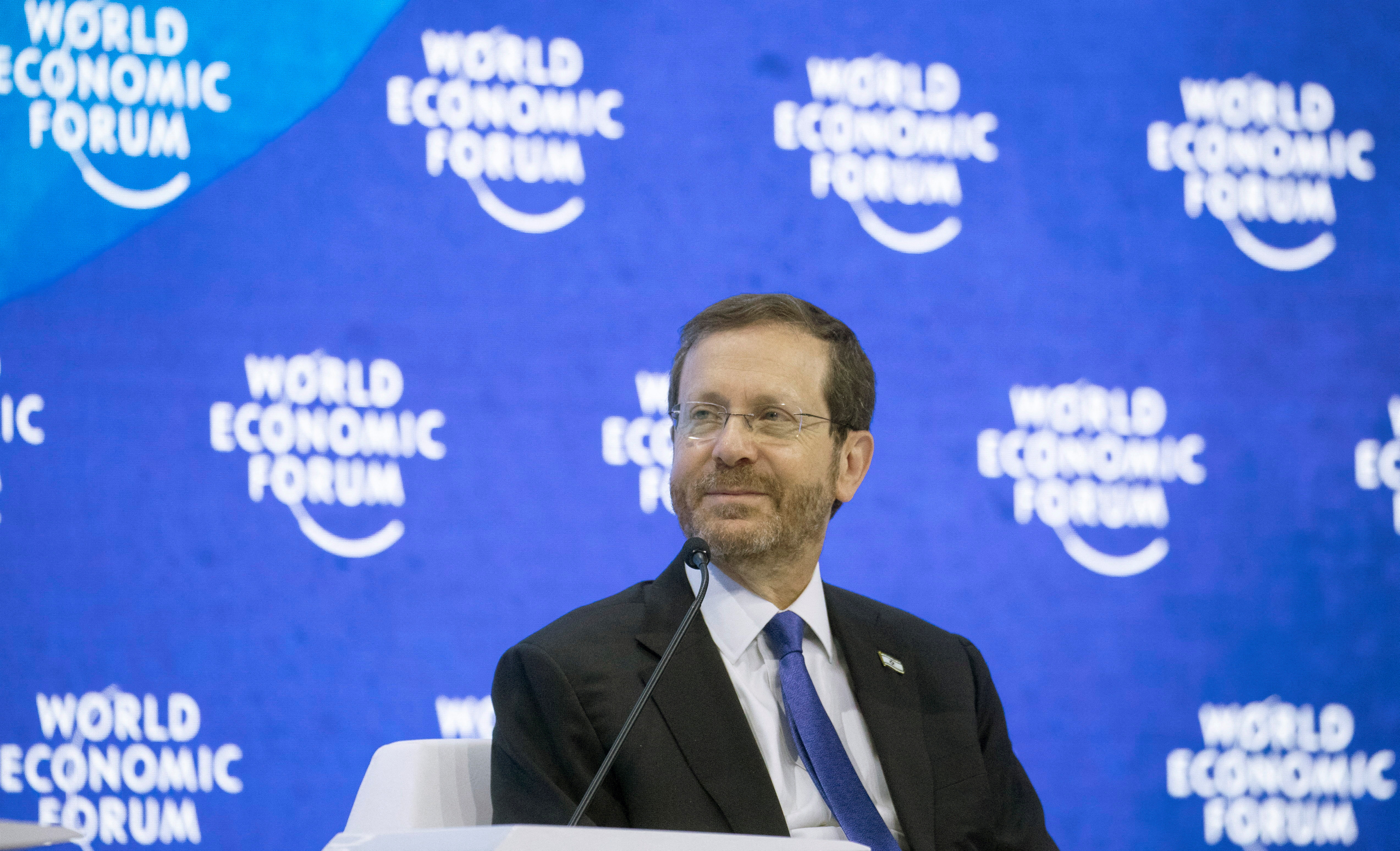 Israeli President Herzog smiles at the World Economic Forum 2022 in Davos
