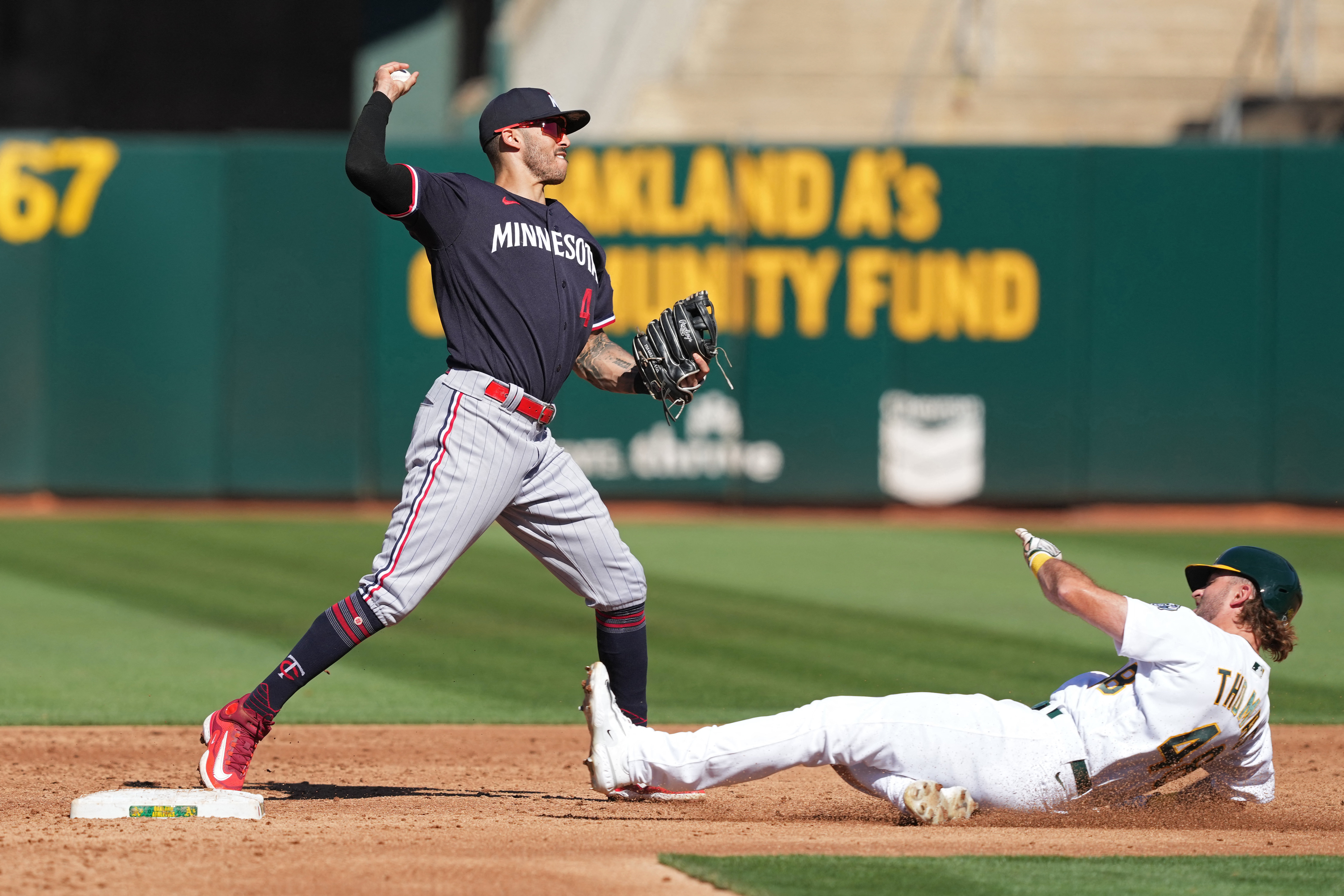 Twins recover from blown lead to topple A's, 10-7