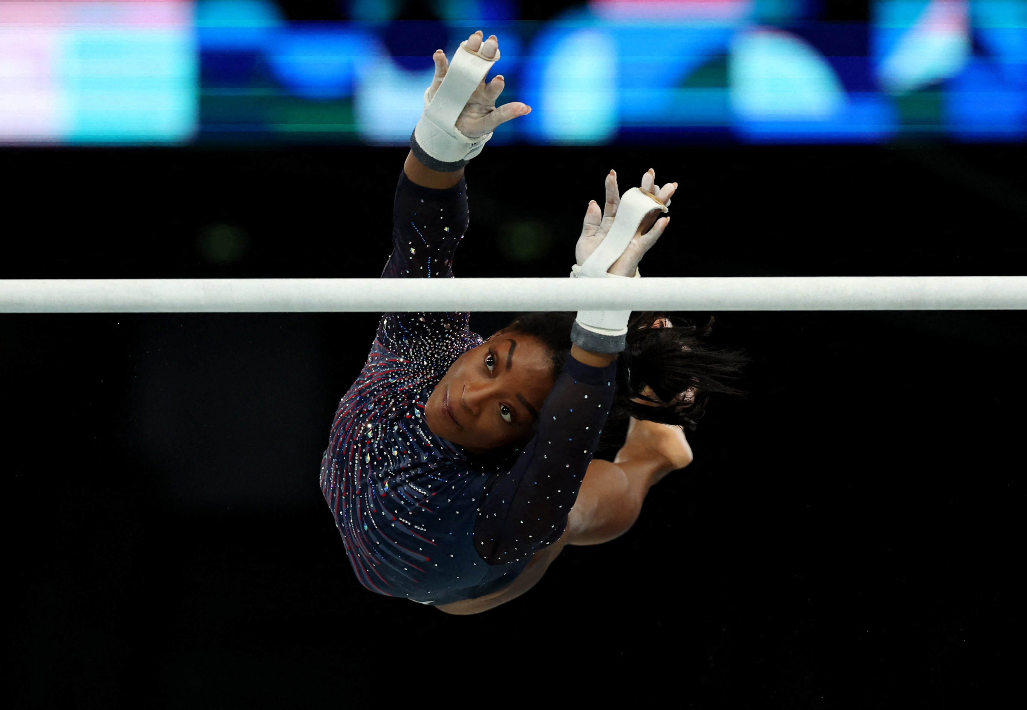 US women gymnasts dazzle in crystal-studded leos | Reuters