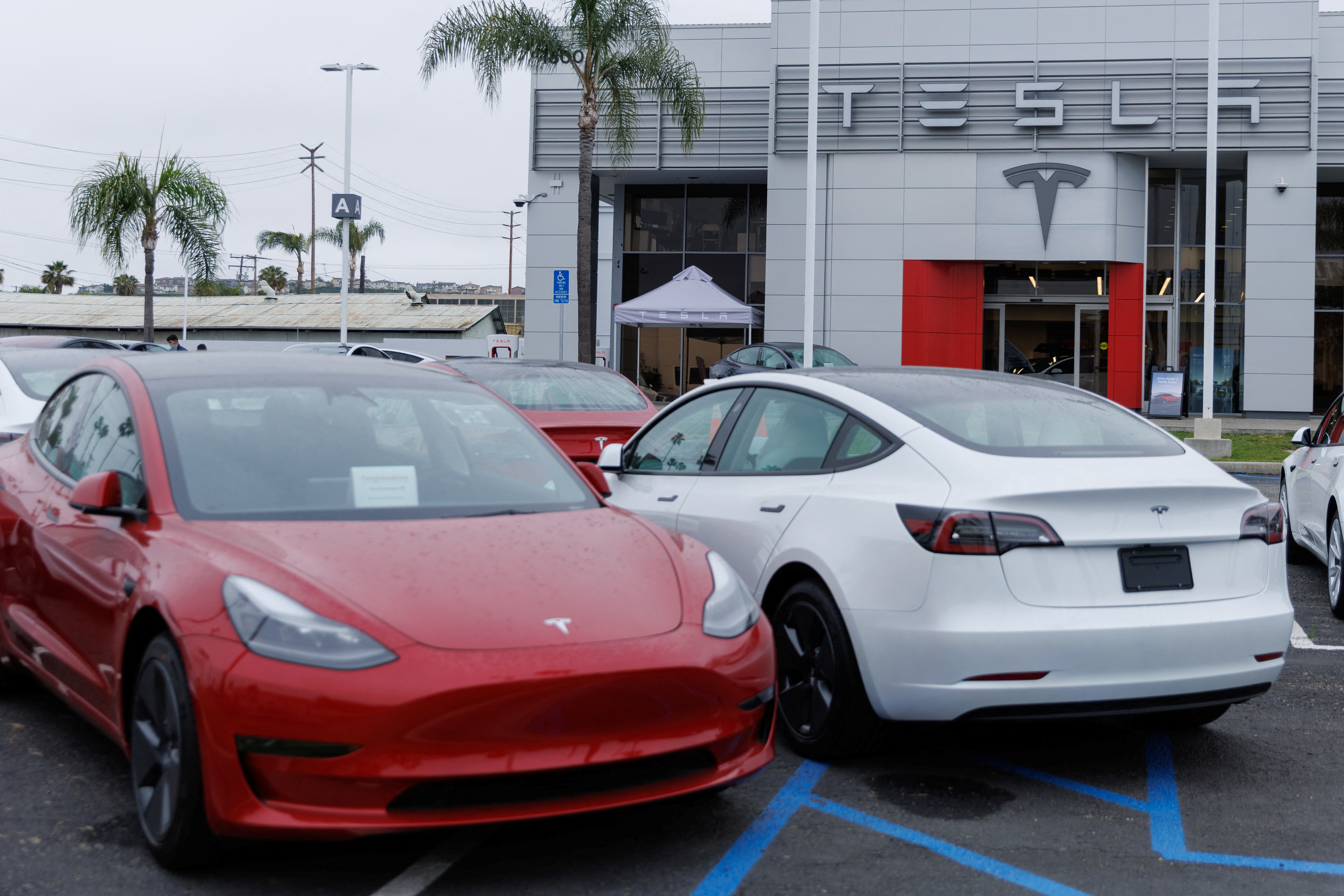 Tesla Model 3 vehicles shown for sale in Long Beach