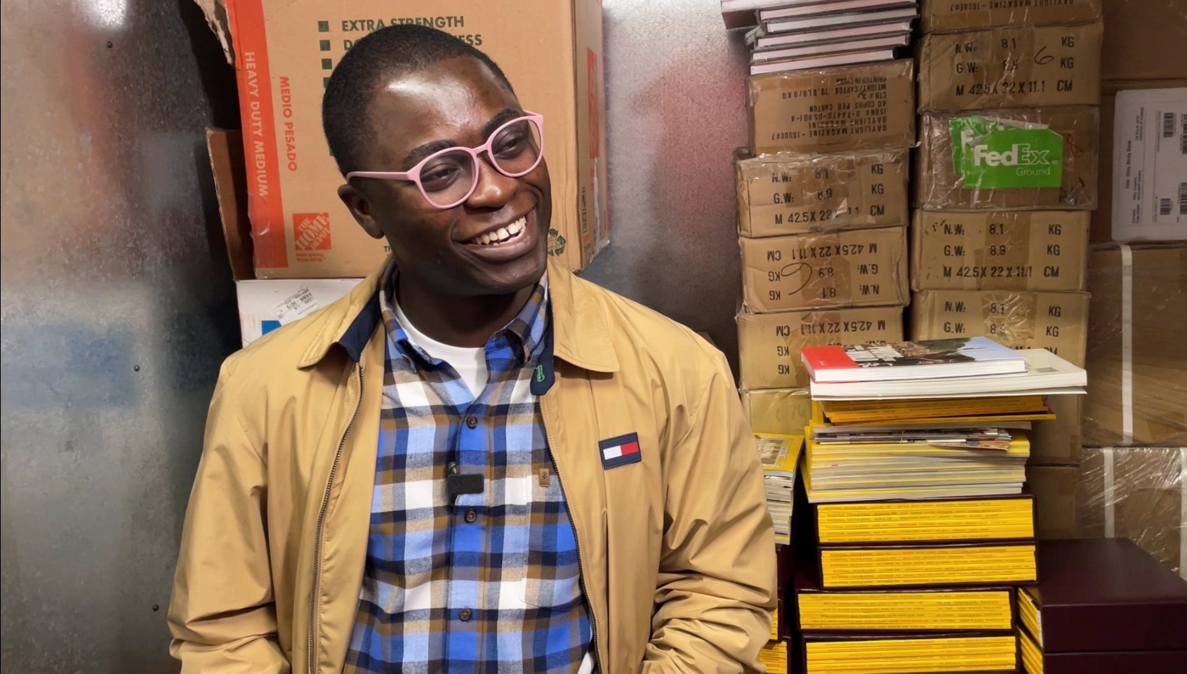 Ghanaian photographer Paul Ninson smiles while speaking to a journalist, in New York