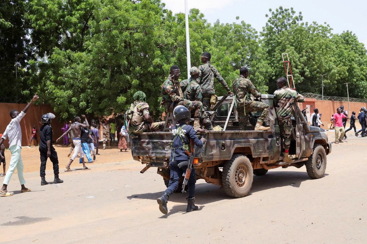 Pro-junta protesters gather outside the French Embassy in Niamey