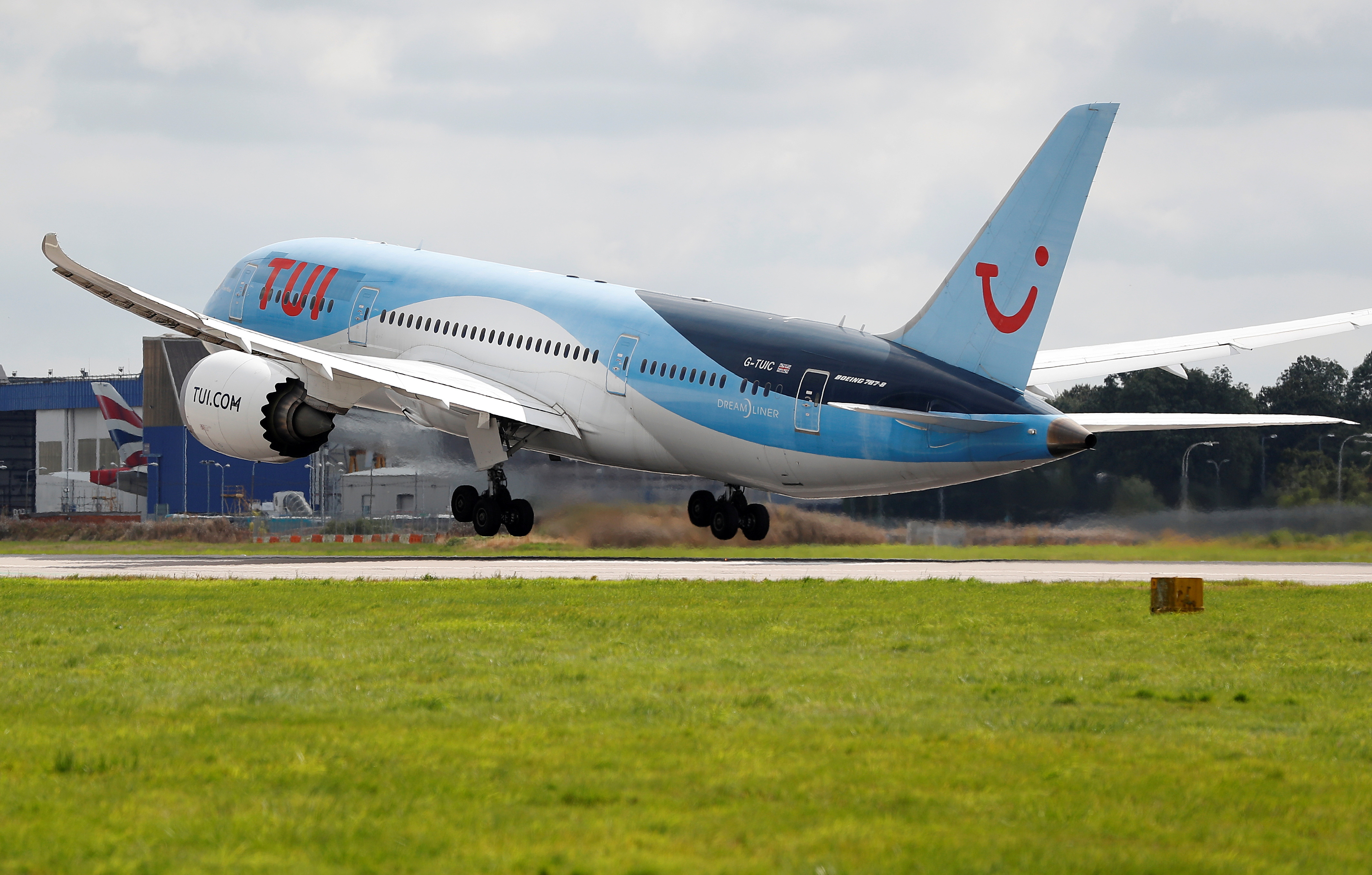 A Boeing 787 of the travel company TUI takes off from the southern runway at Gatwick Airport in Crawley