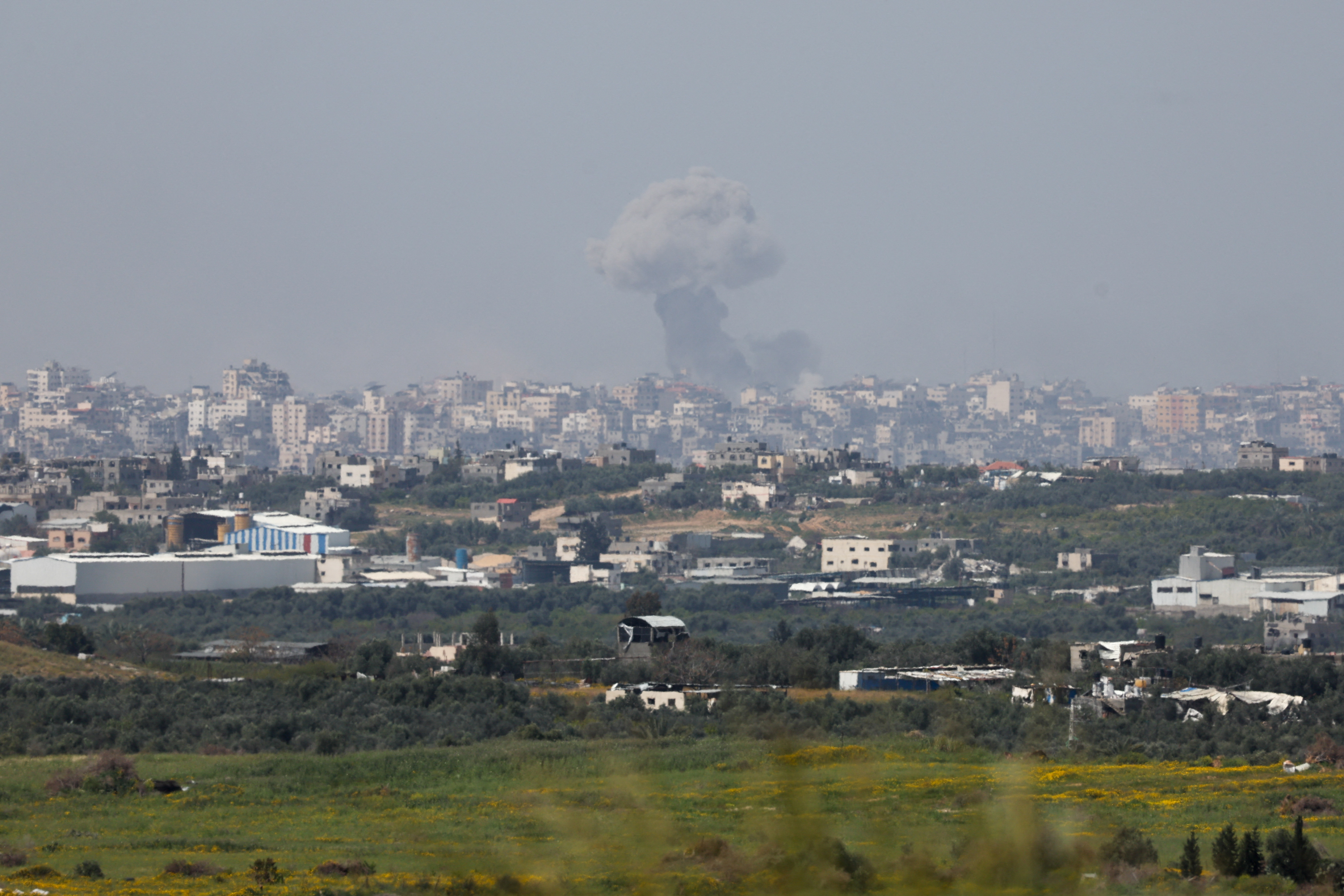 Smoke rises over Gaza following an explosion, as seen from Israel