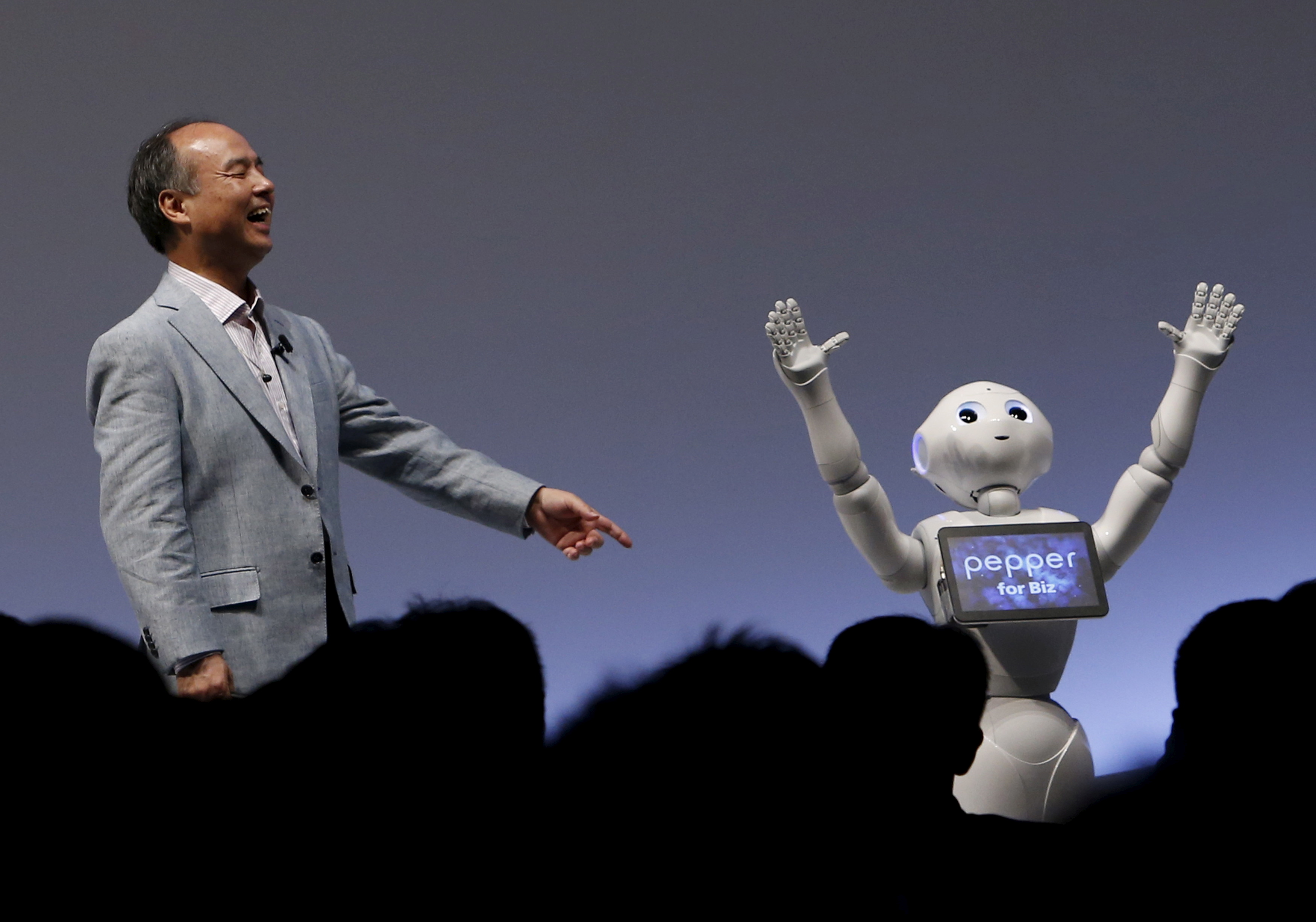 SoftBank Group Corp. Chairman and CEO Masayoshi Son reacts as SoftBank's human-like robots named 