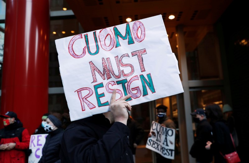 Demonstrators gather outside the New York Governor Andrew Cuomo's office calling for his resignation, in the Manhattan borough of New York