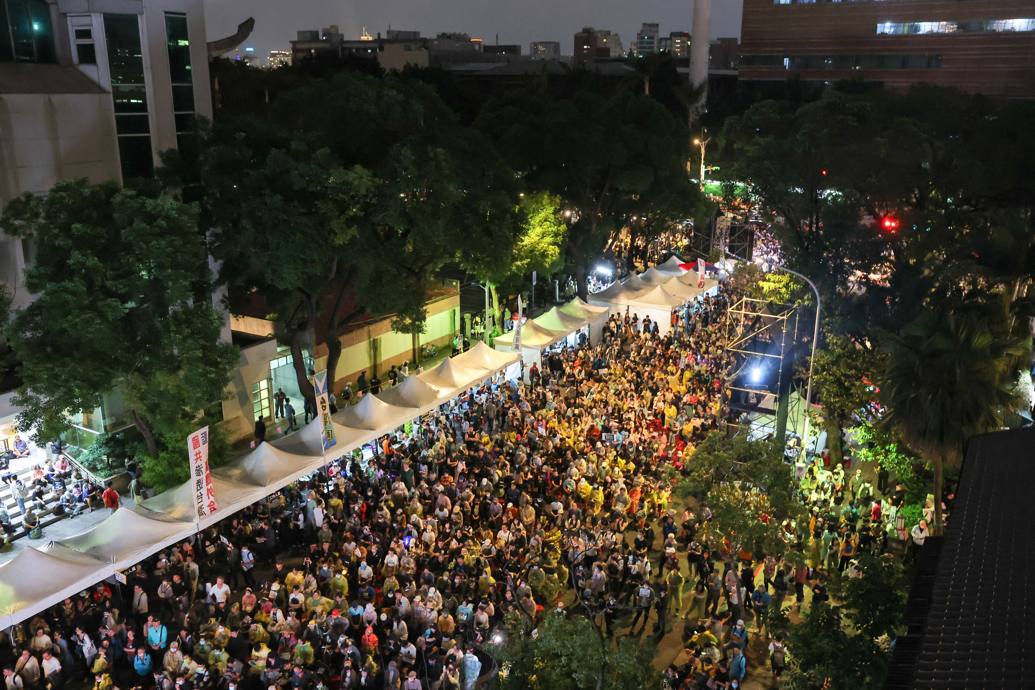 People gather outside the parliament in Taipei