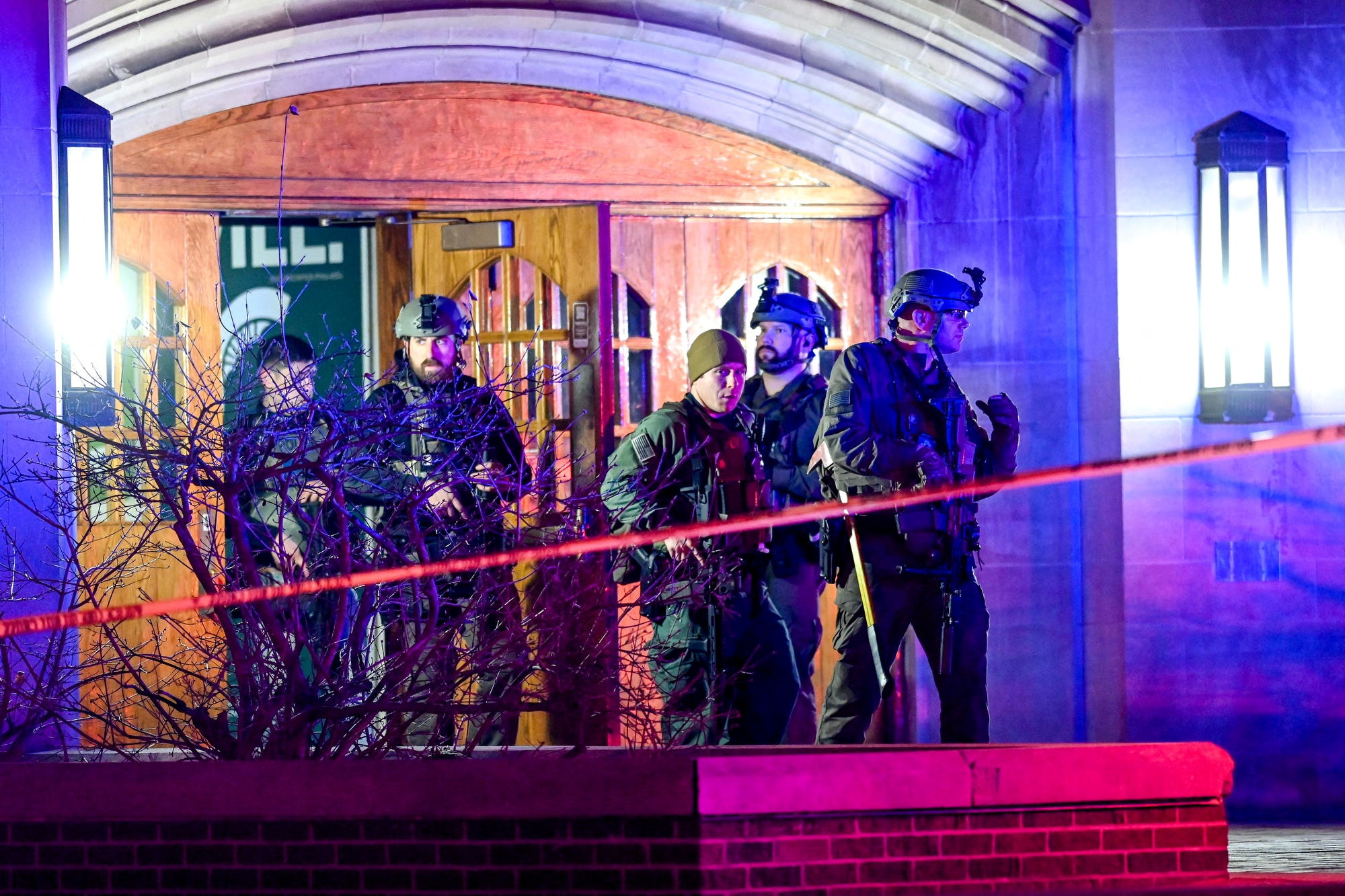 Police walk around Berkey Hall after shooting at Michigan State