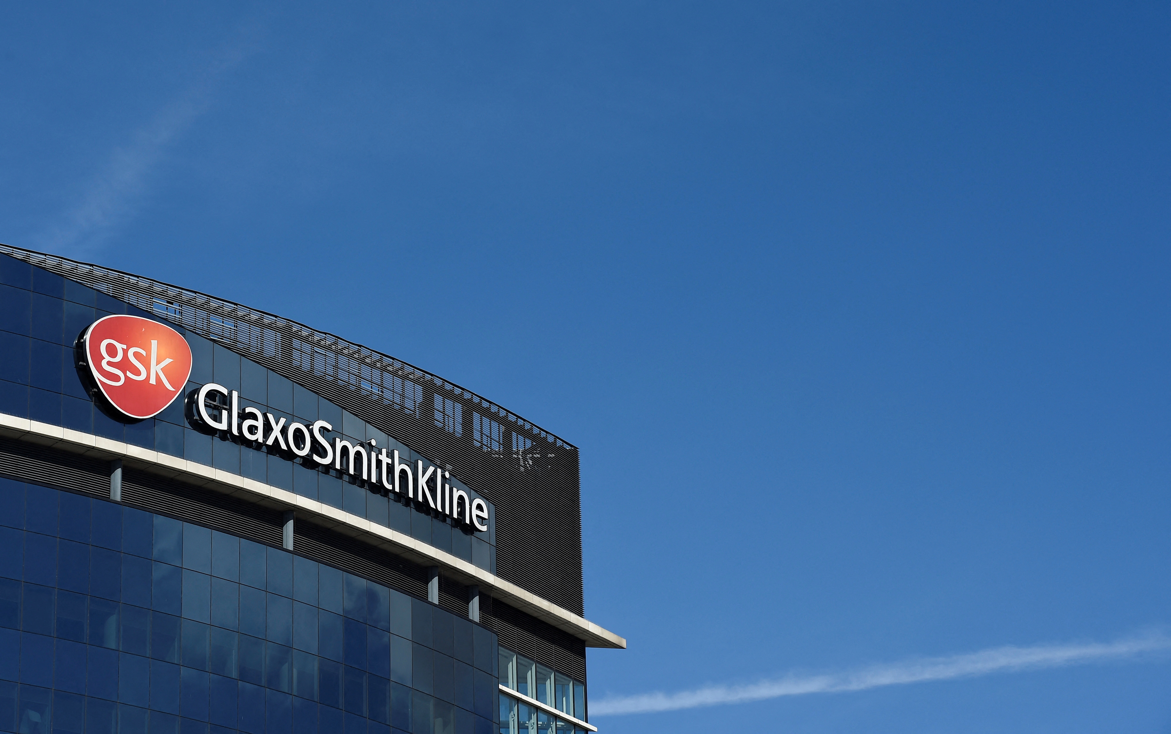 Signage for GlaxoSmithKline is seen on it's offices in London, Britain