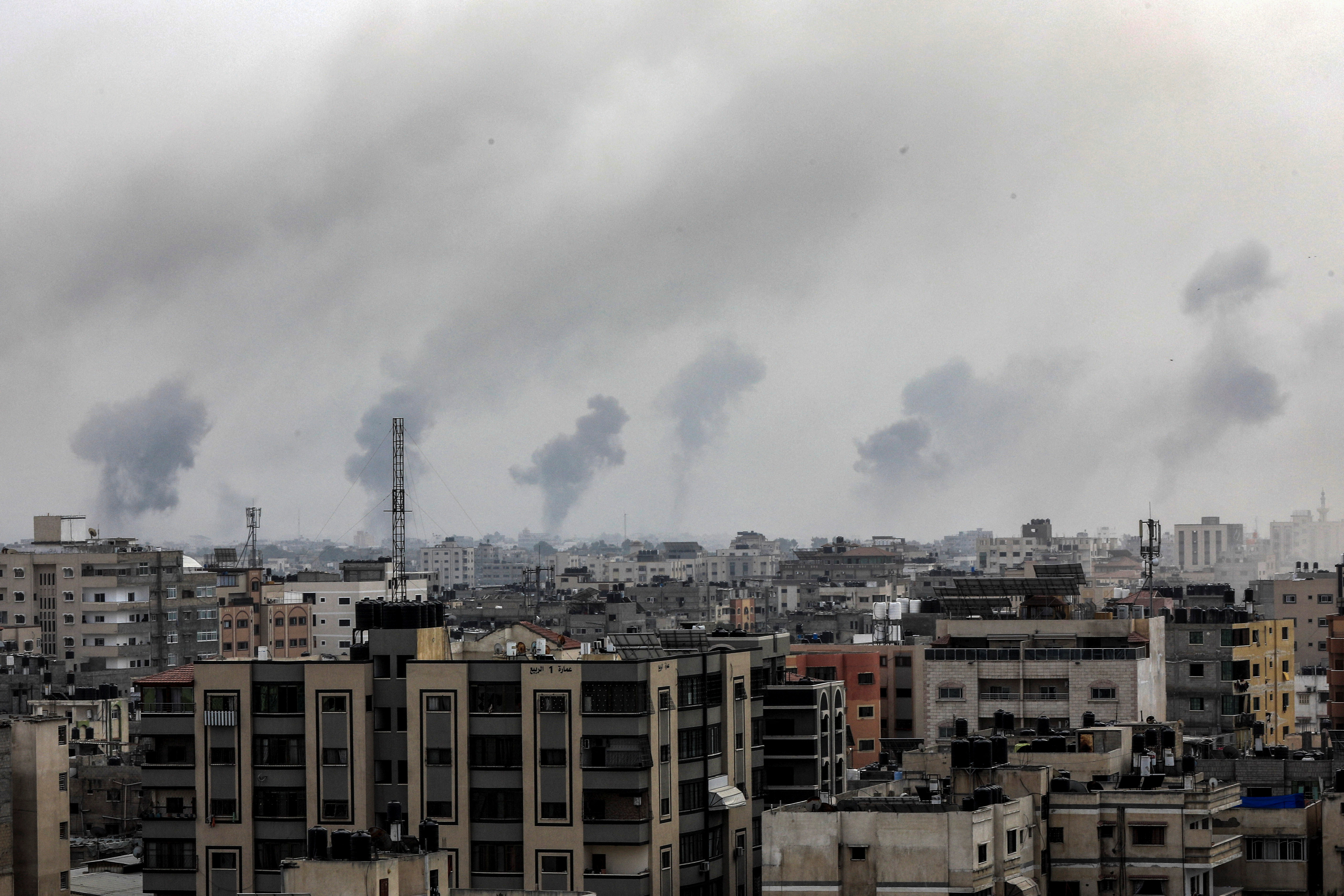 Plumes of smoke rise during Israeli strikes in Gaza