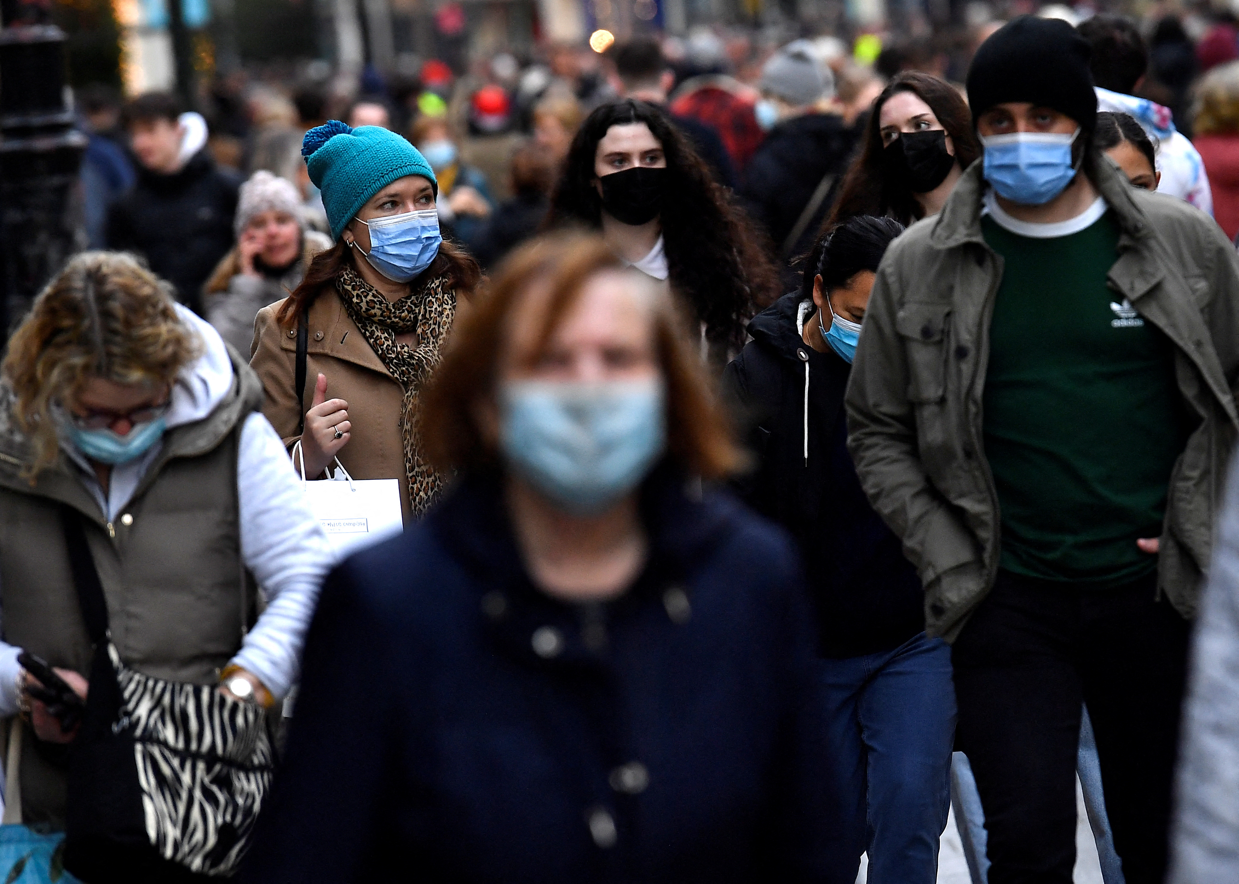 People wear protective face masks while out for Christmas shopping in Dublin