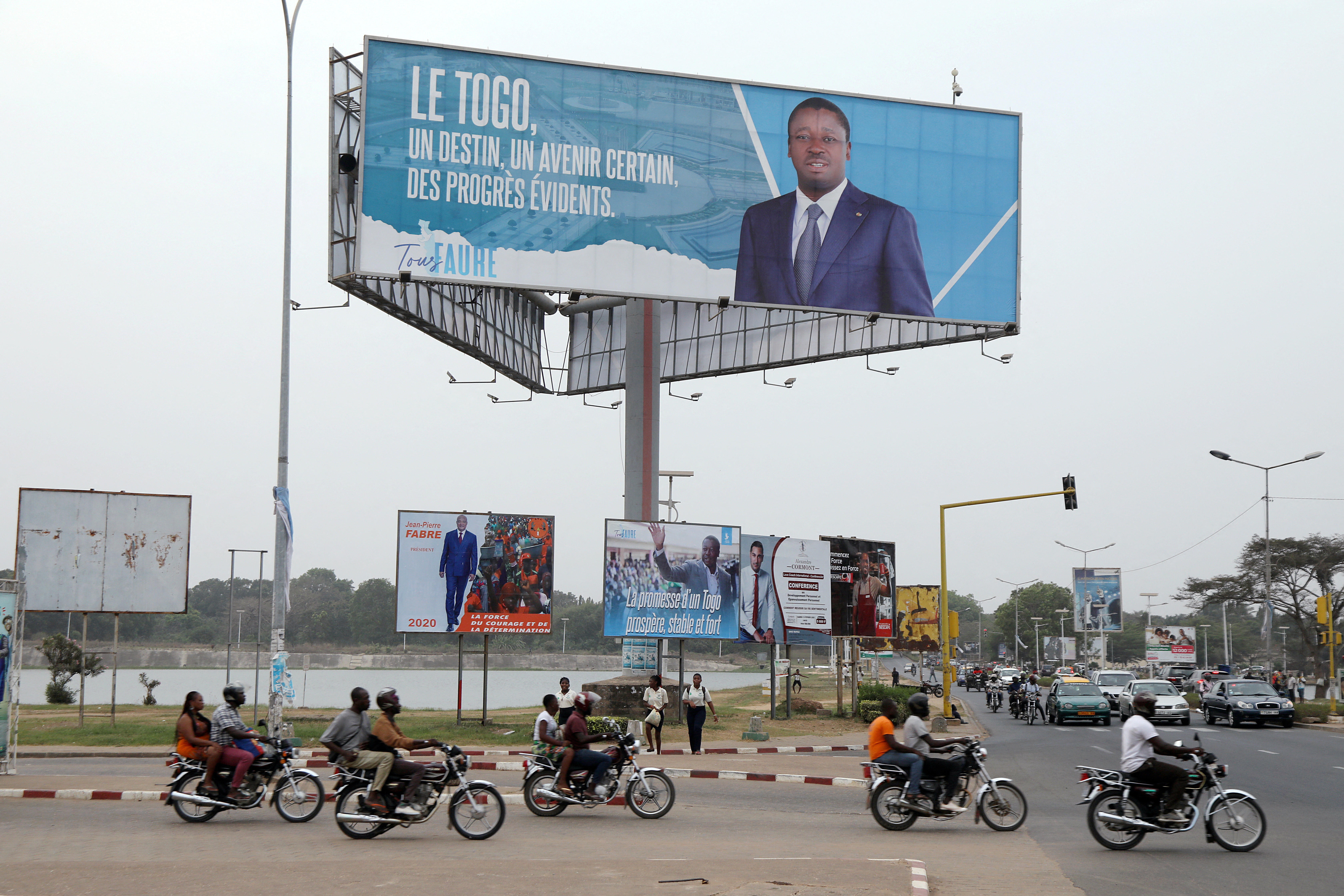 A billboard of presidential candidate of UNIR Gnassingbe is pictured on a street in Lome