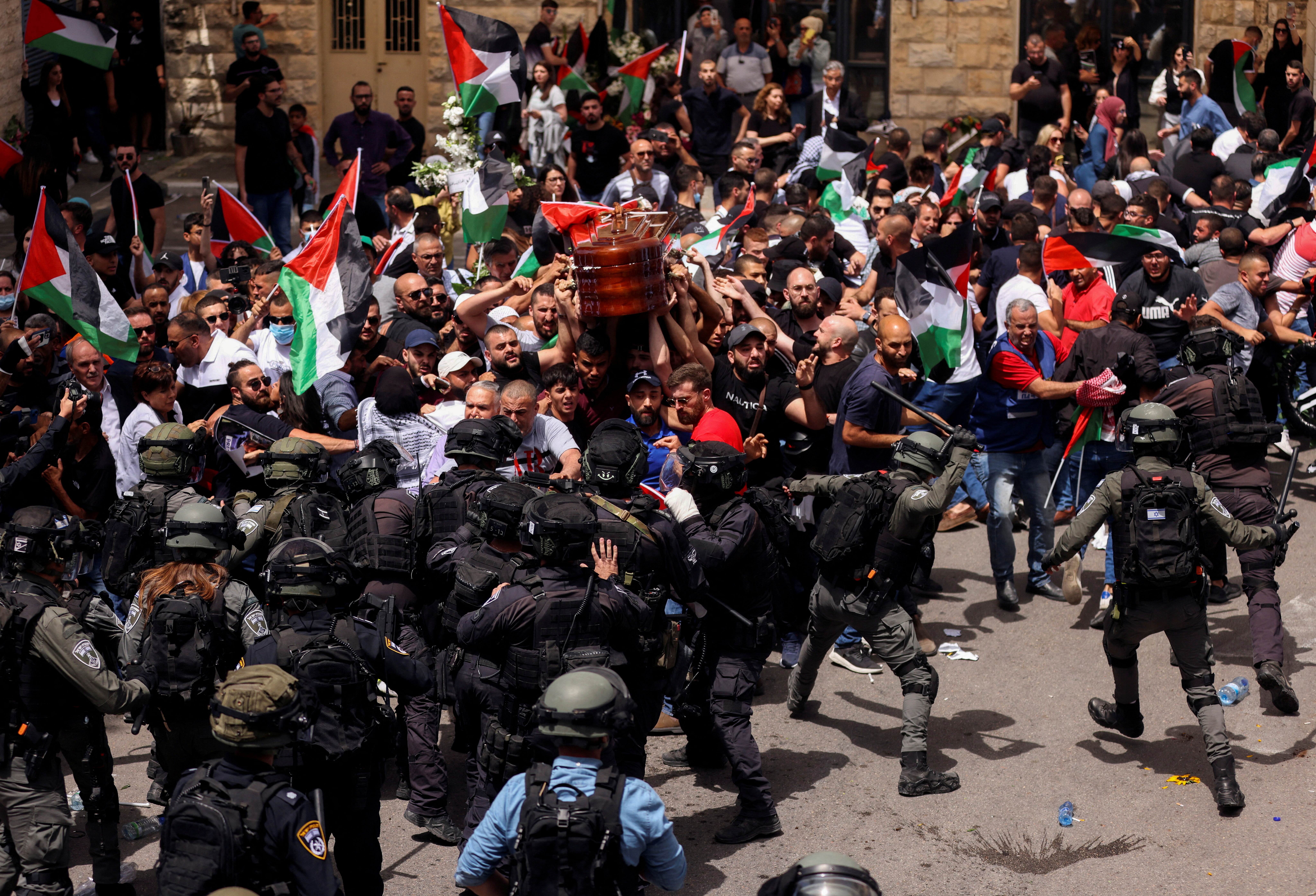 Family and friends carry the coffin of Al Jazeera reporter Shireen Abu Akleh during her funeral in Jerusalem