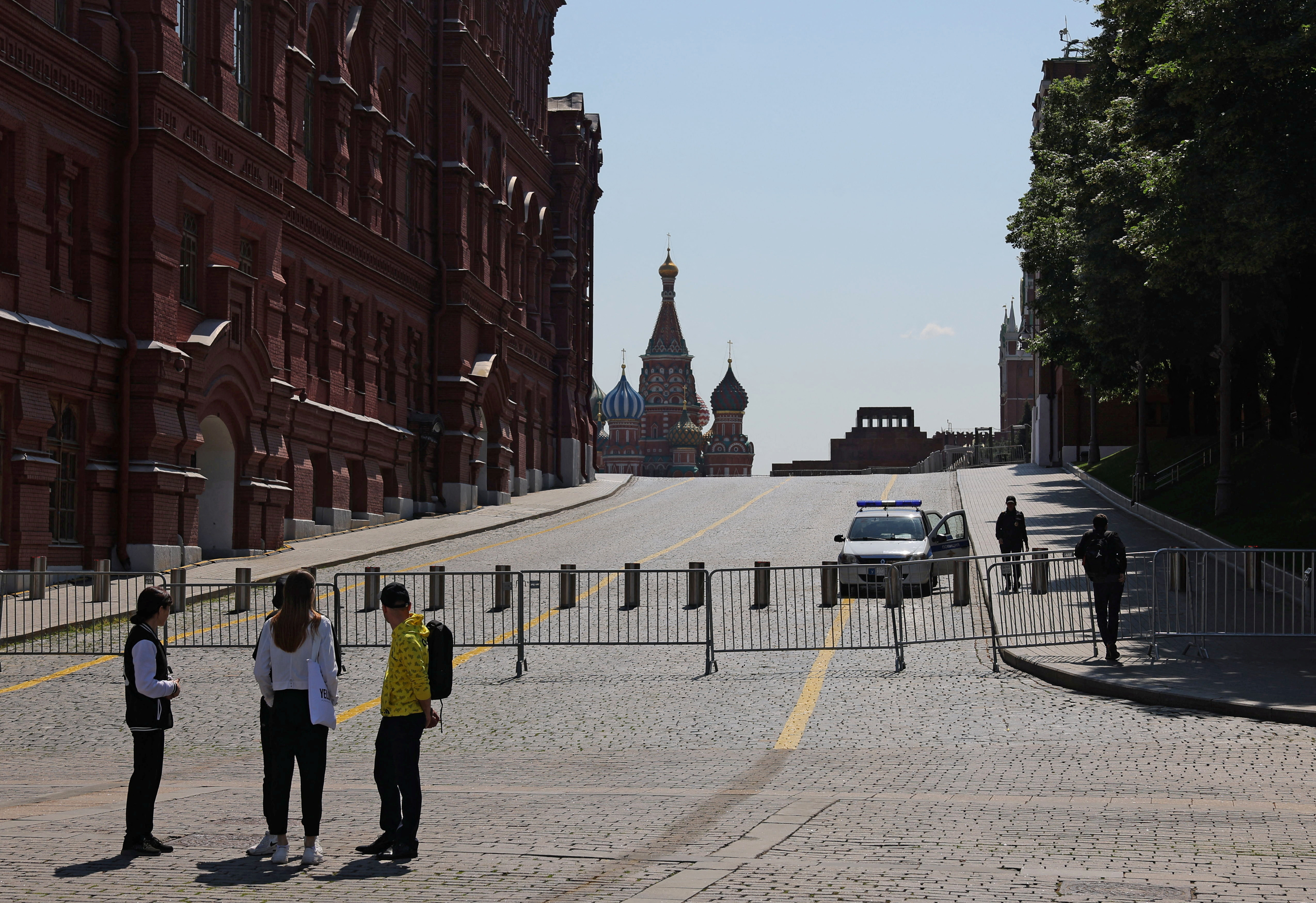 People stand near the closed Red Square in Moscow