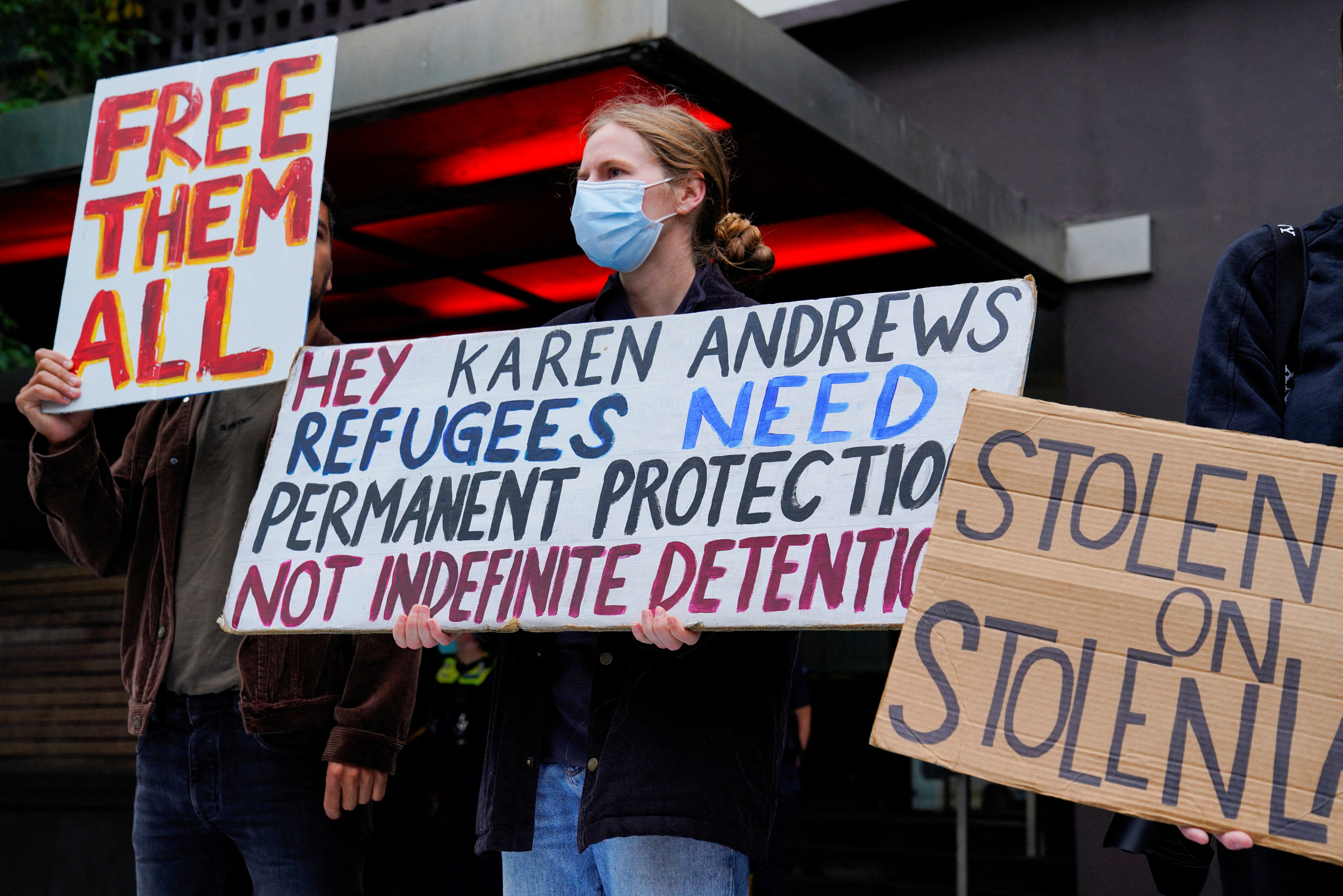 Pro-refugee protestors rally outside the police-guarded Park Hotel, where Serbian tennis player Novak Djokovic is believed to be held while he stays, in Melbourne, Australia, January 10, 2022. REUTERS/Sandra Sanders