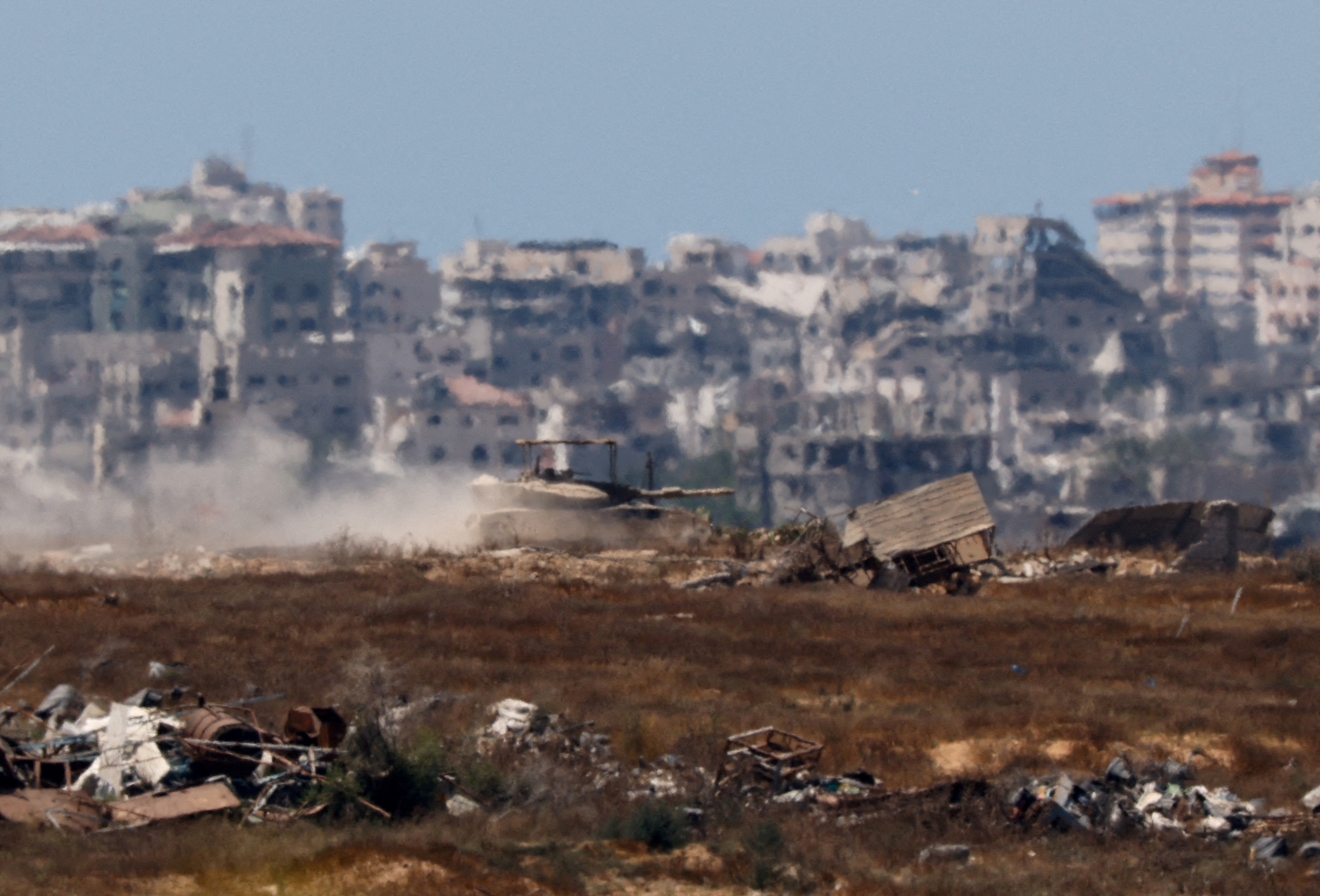 An Israeli tank manoeuvres inside the Gaza Strip