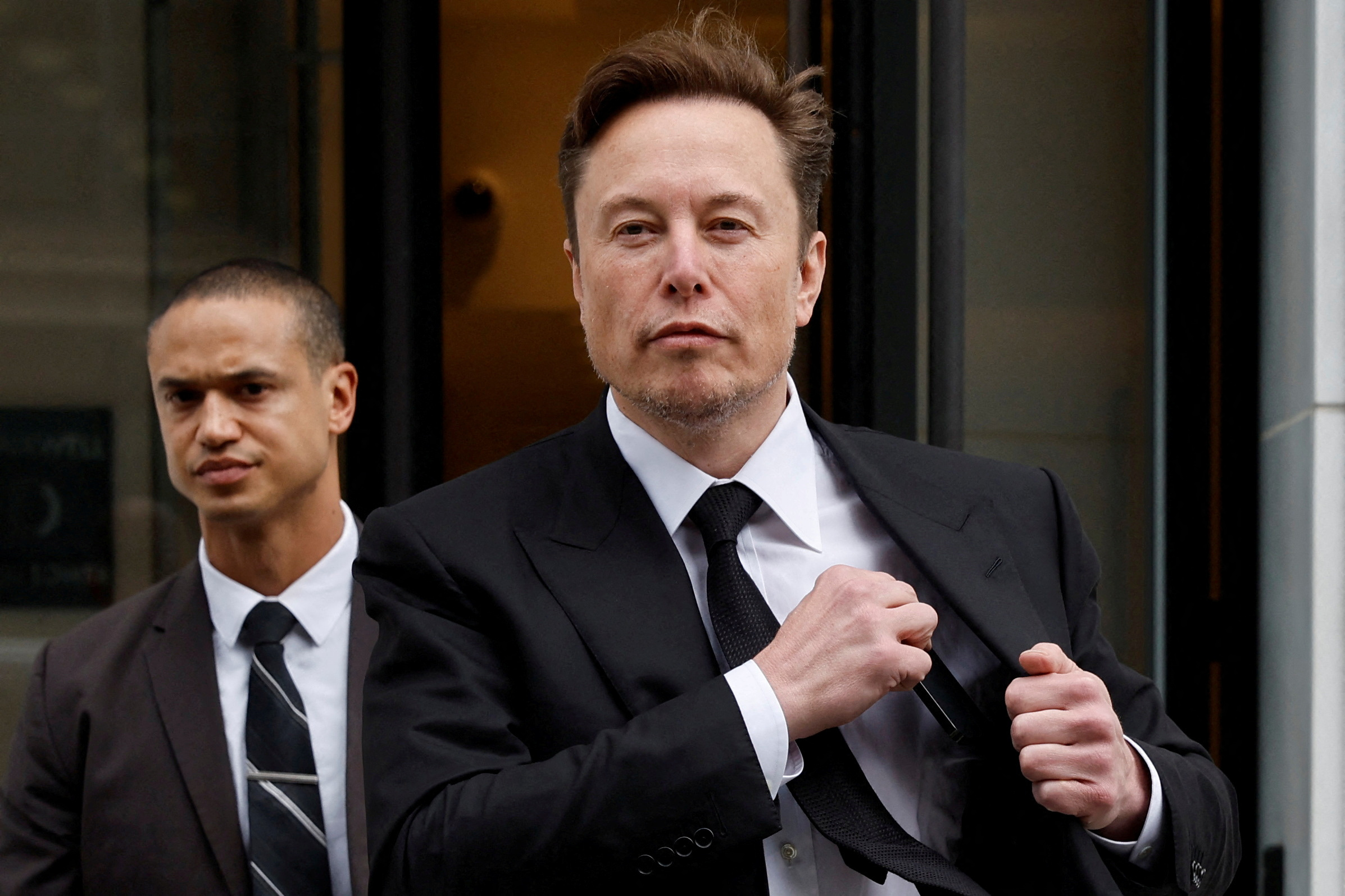 Tesla CEO Musk departs the company’s local office in Washington