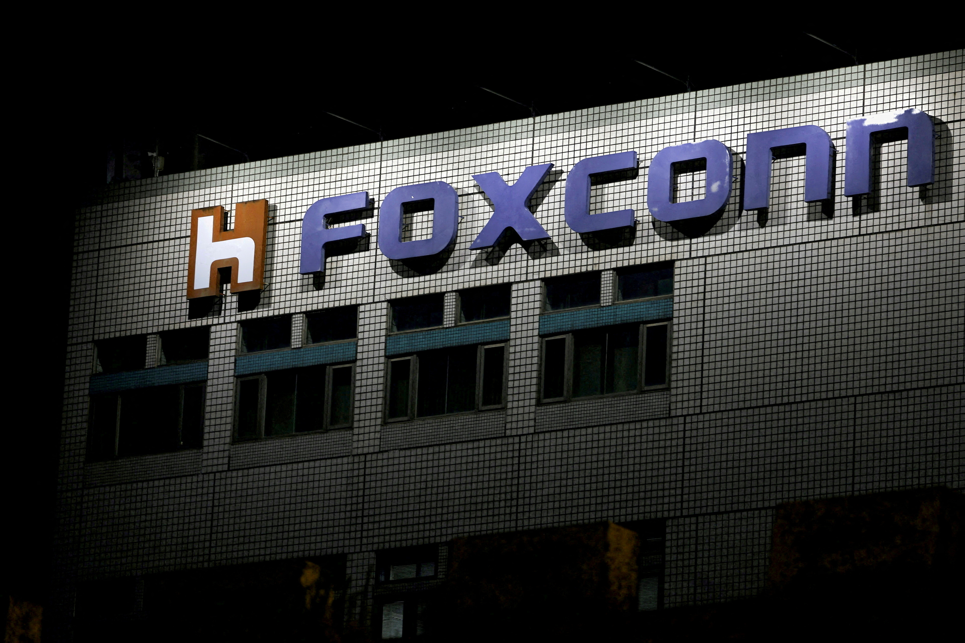 The logo of Foxconn is seen outside a building in Taipei