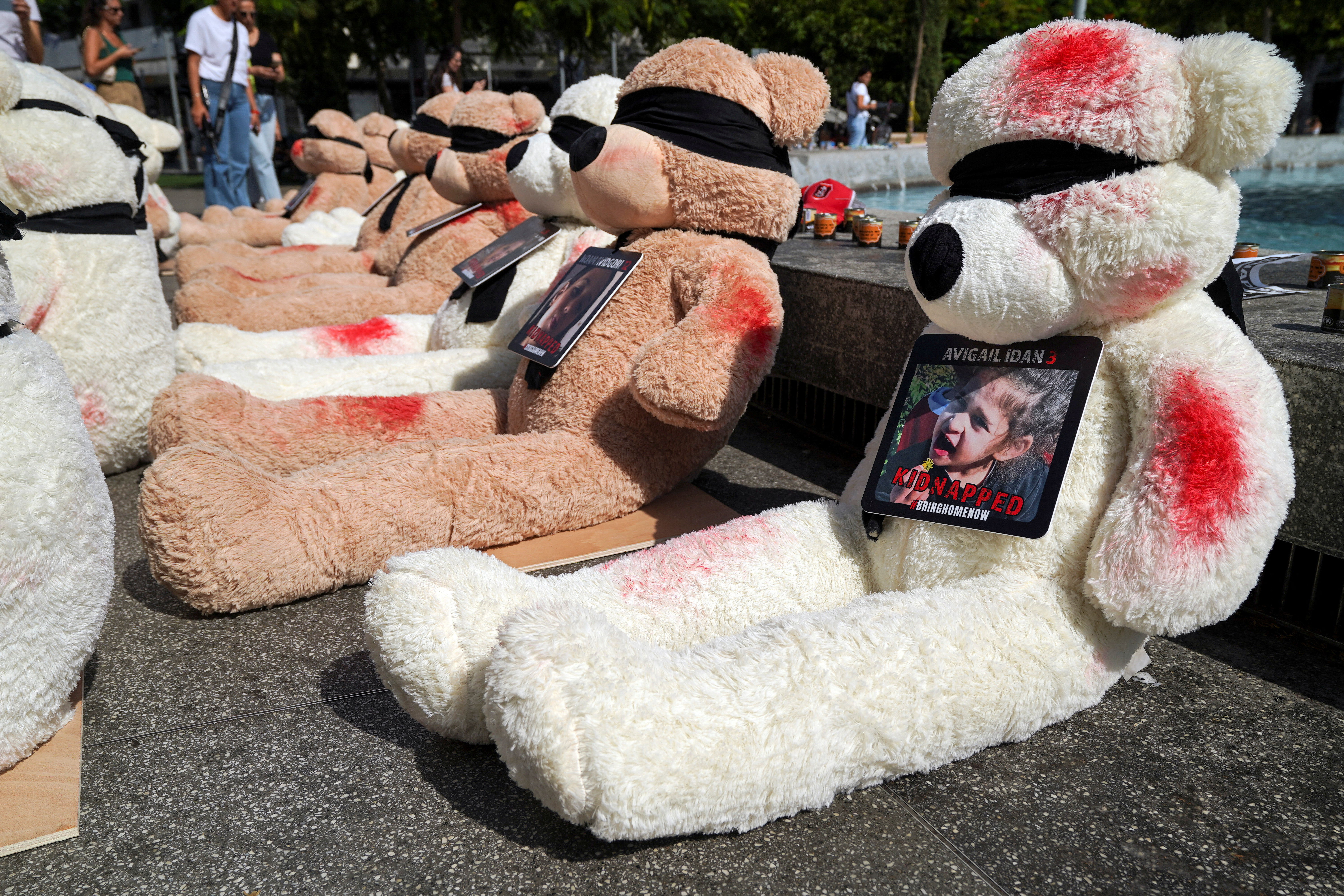 A view shows teddy bears, each representing children who are believed to be held hostage in Gaza, in Tel Aviv