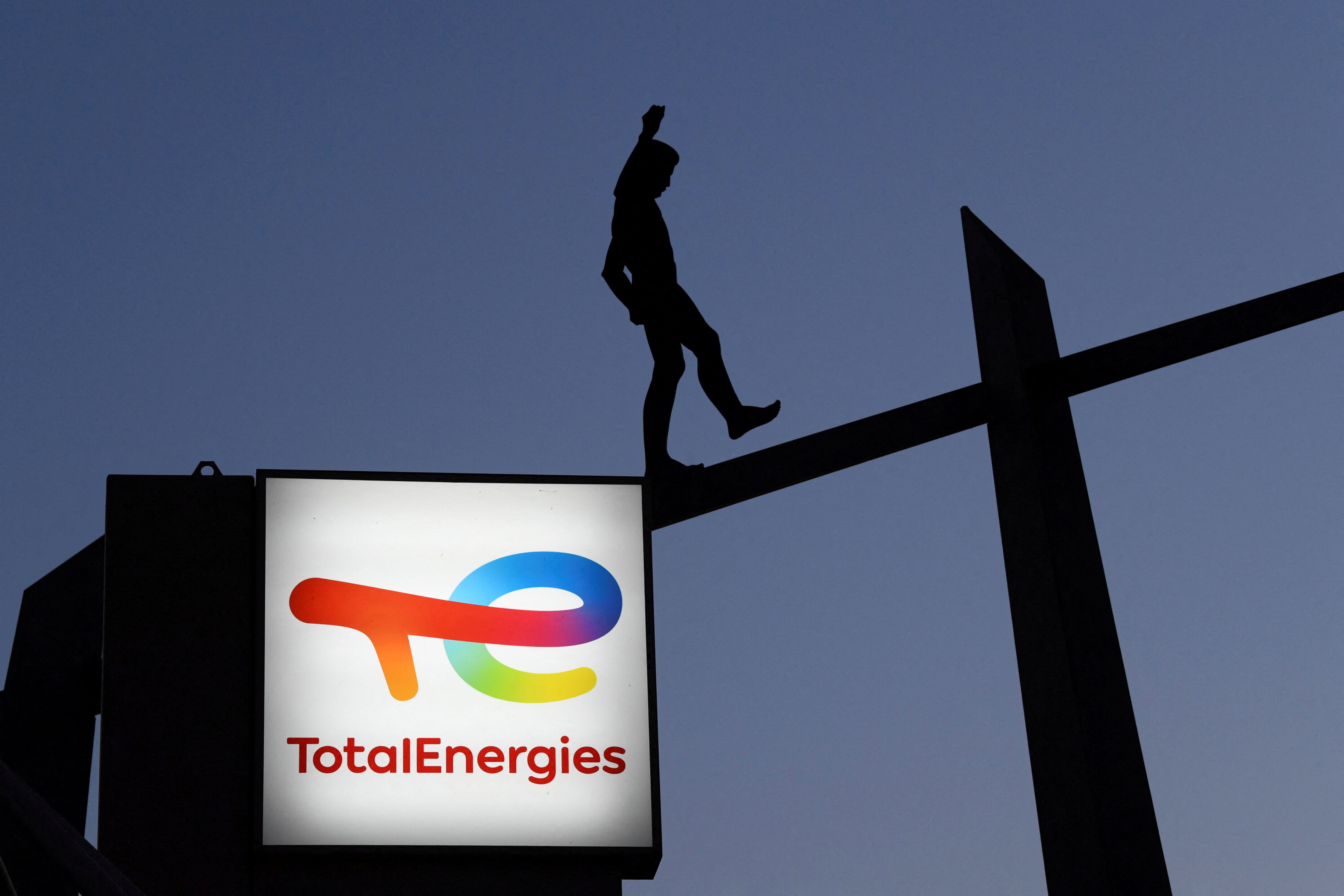 A TotalEnergies logo on a display at a fuel station in Berlin