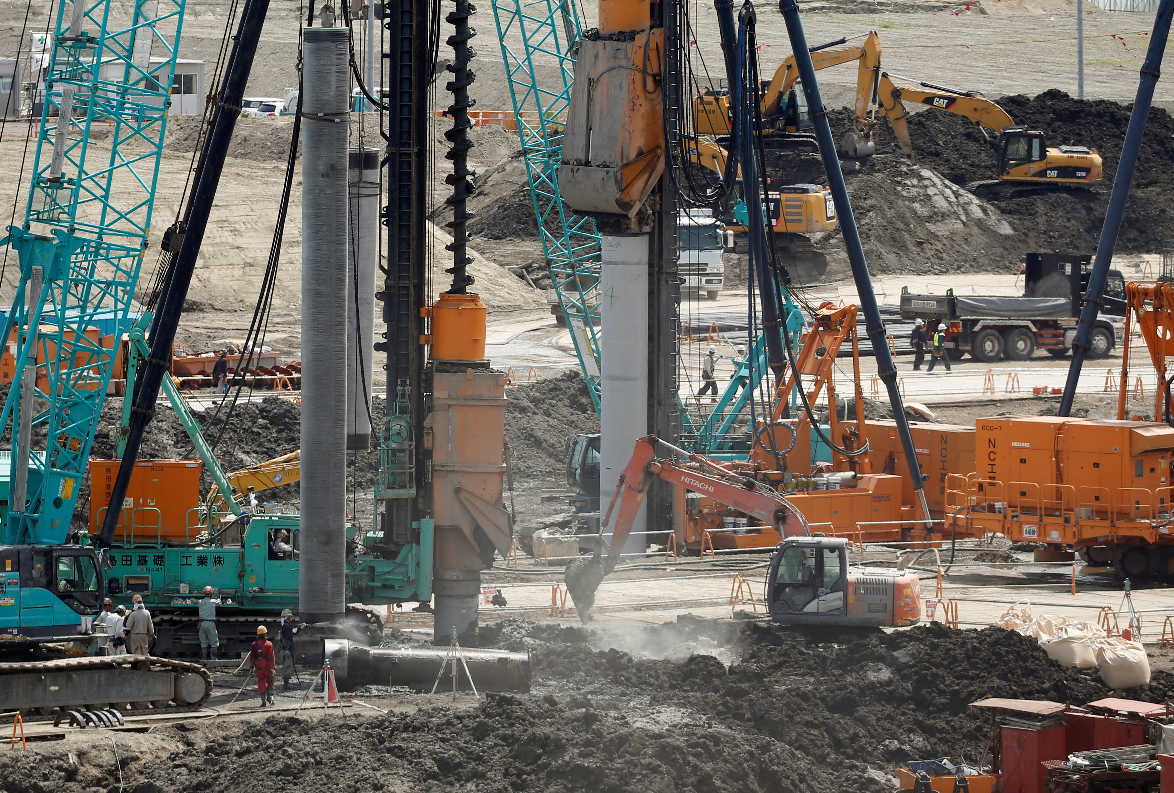 Heavy machines are seen at a construction site in Tokyo