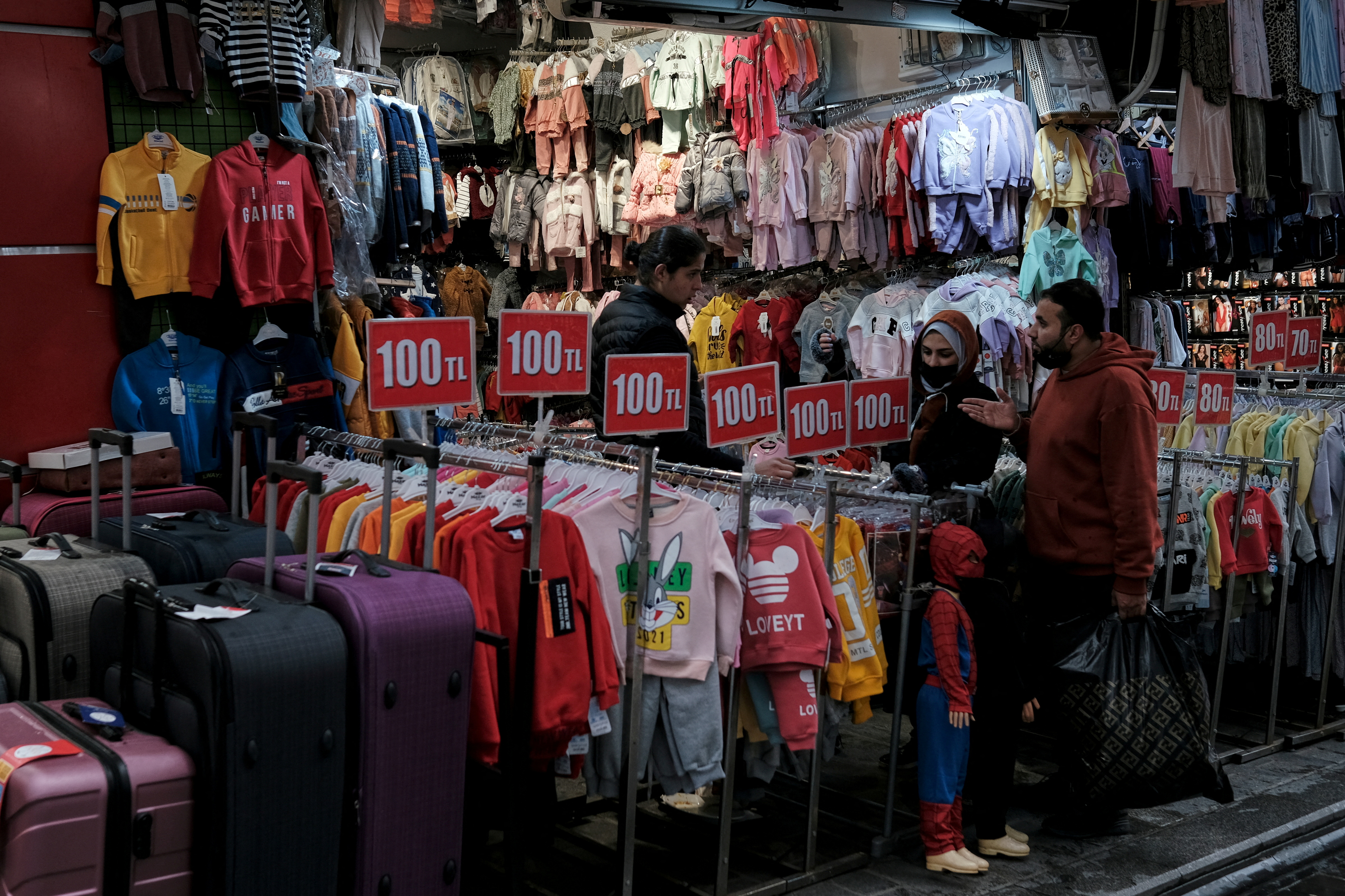 Foreign tourists shop at Mahmutpasa street, a popular middle-class shopping area, in Istanbul