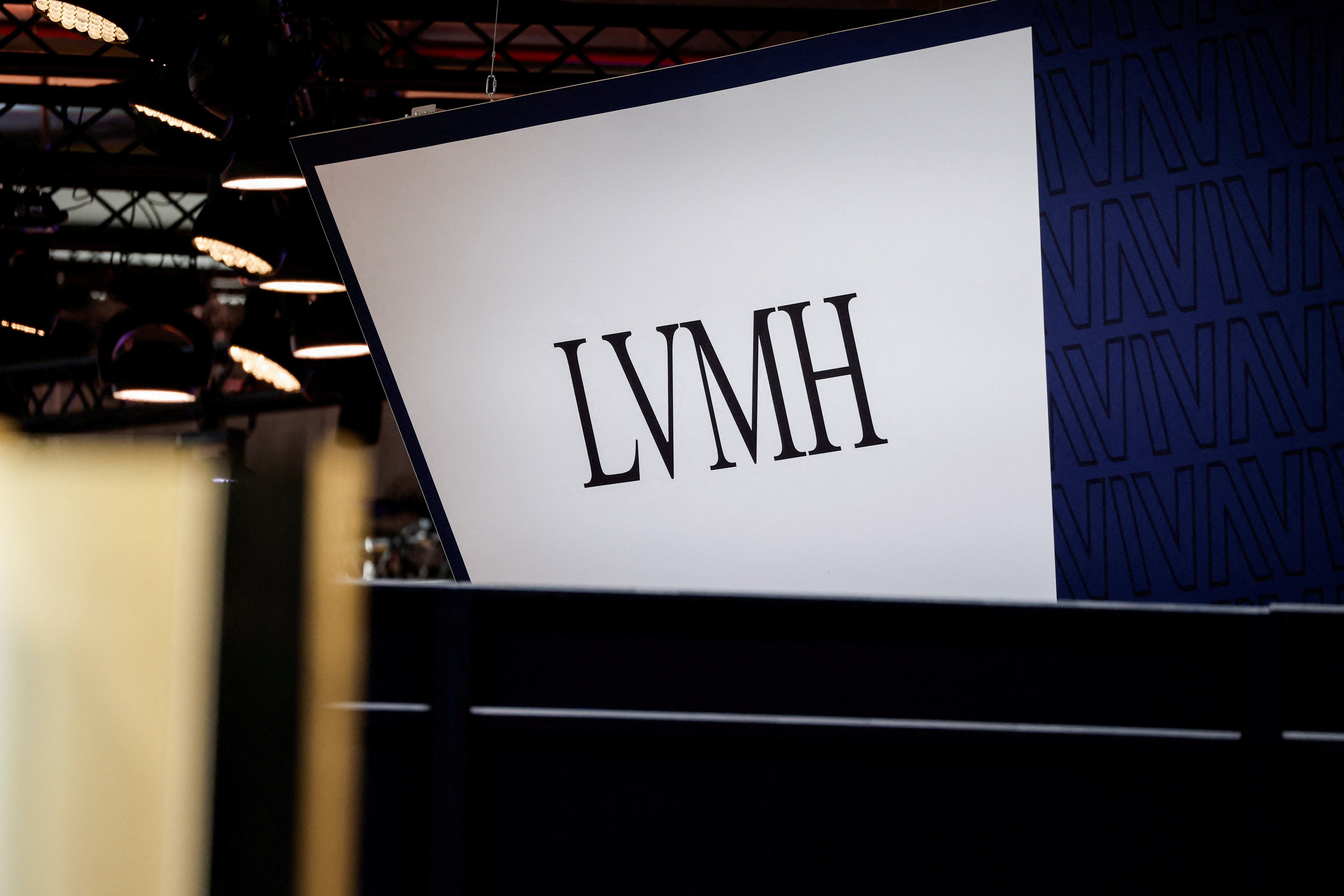 LVMH company logo on a website with blurry stock market