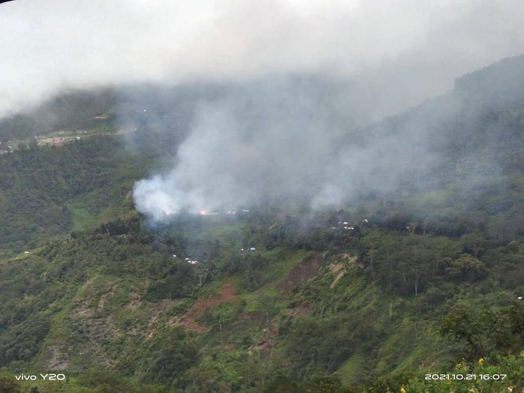 Smoke rises from the highlands following an aerial attack in Kiwirok, Pegunungan Bintang regency