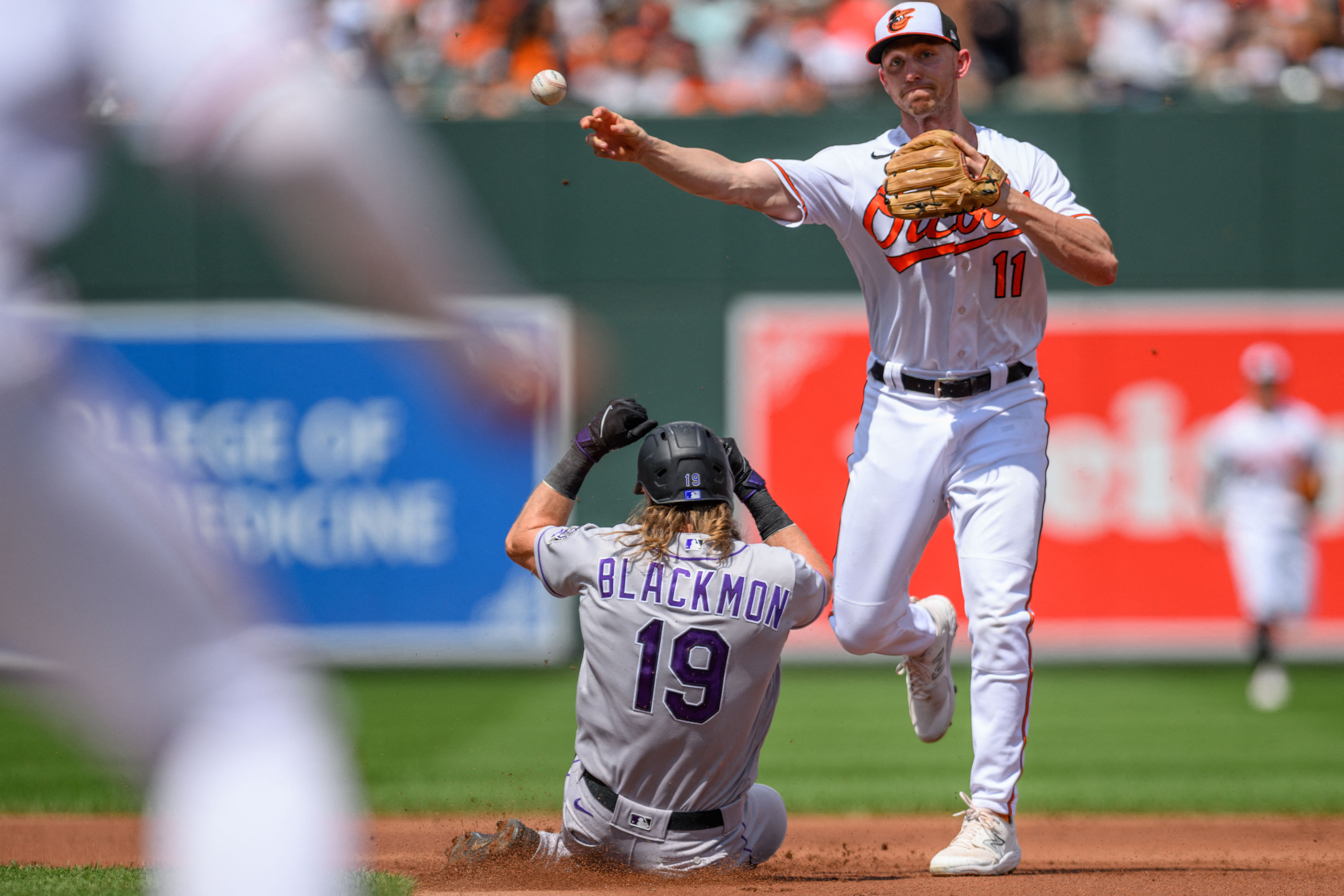 Orioles defeat Rockies on walk-off error