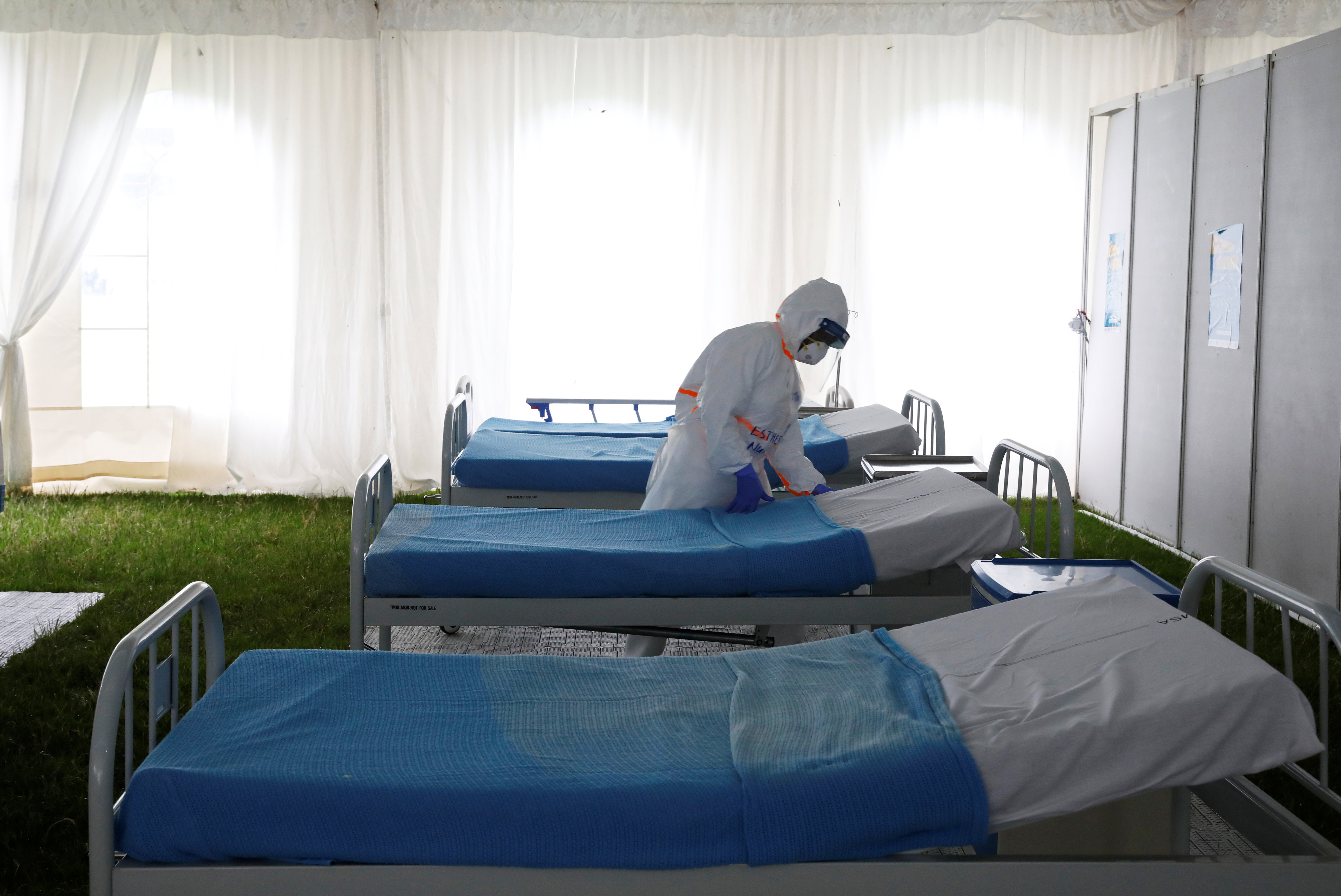 A nurse is seen inside a screening and isolation field hospital set to fight against the spread of the coronavirus disease (COVID-19) at a soccer stadium in the town of Machakos