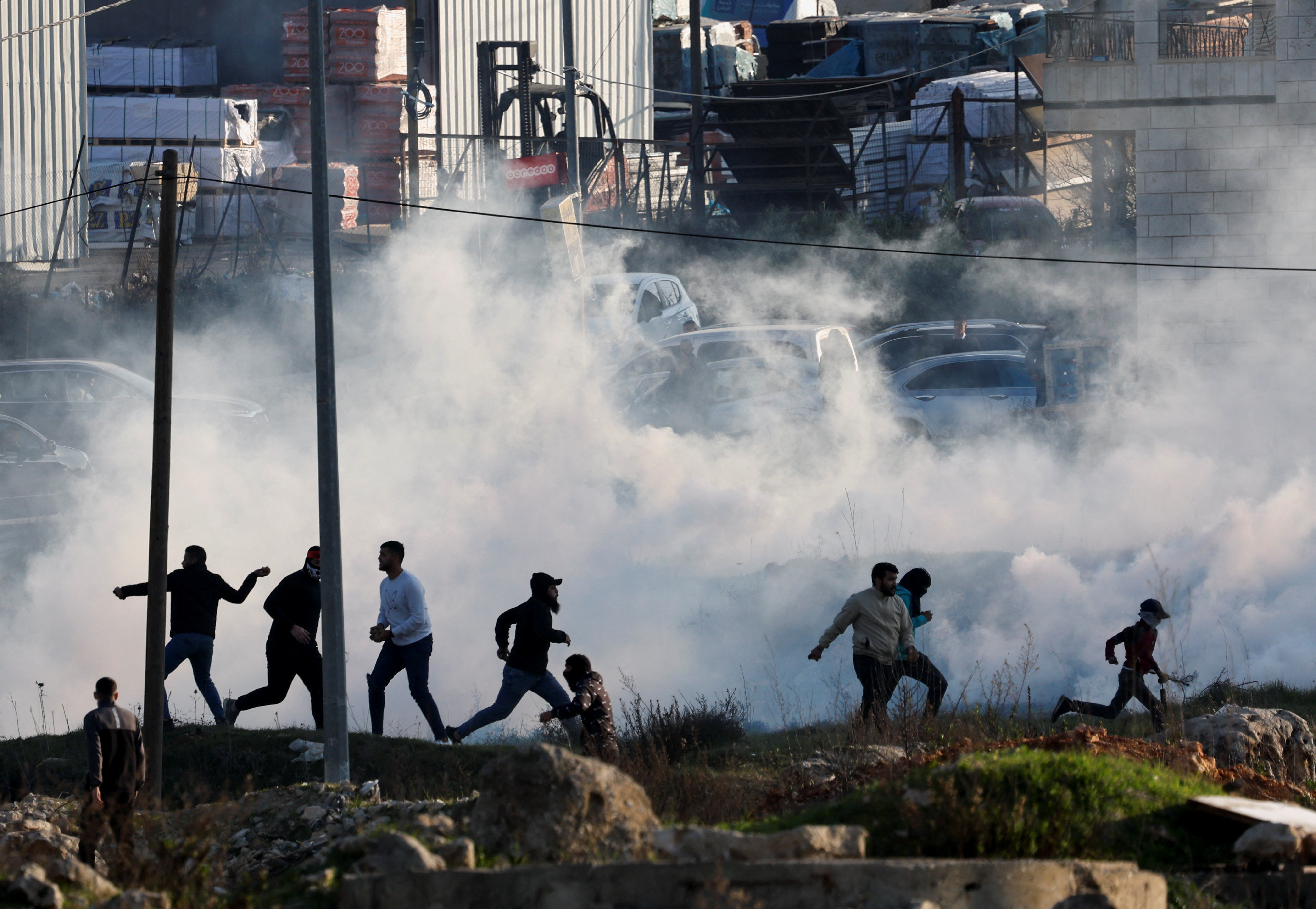 Palestinians clash with Israeli troops near Ramallah in the Israeli-occupied West Bank