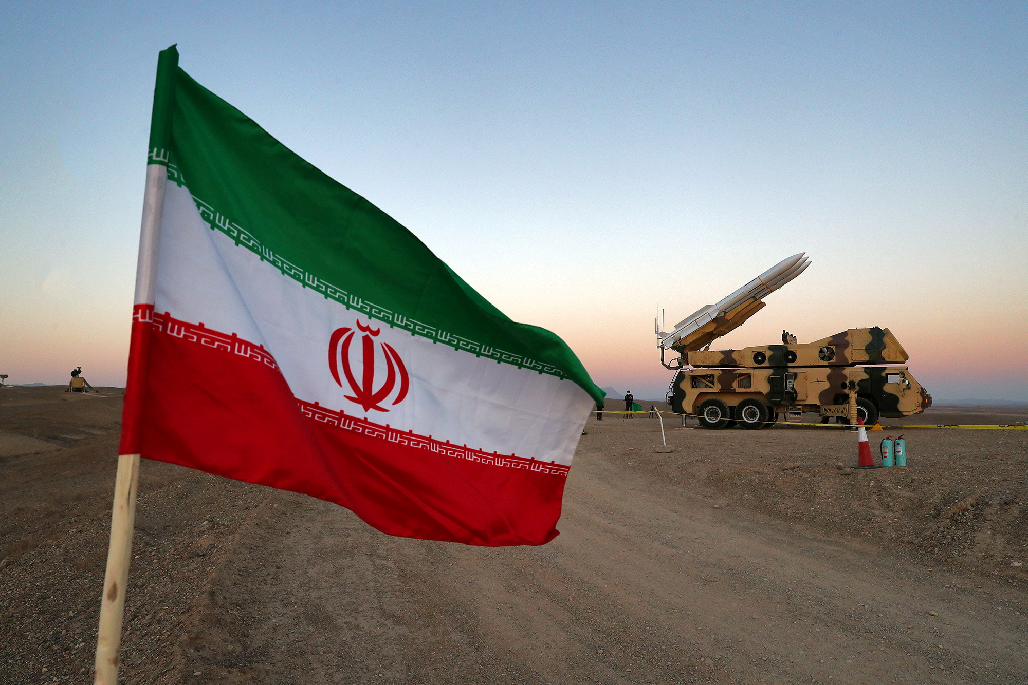 FILE PHOTO: The Iranian flag is pictured near a missile in 2020
