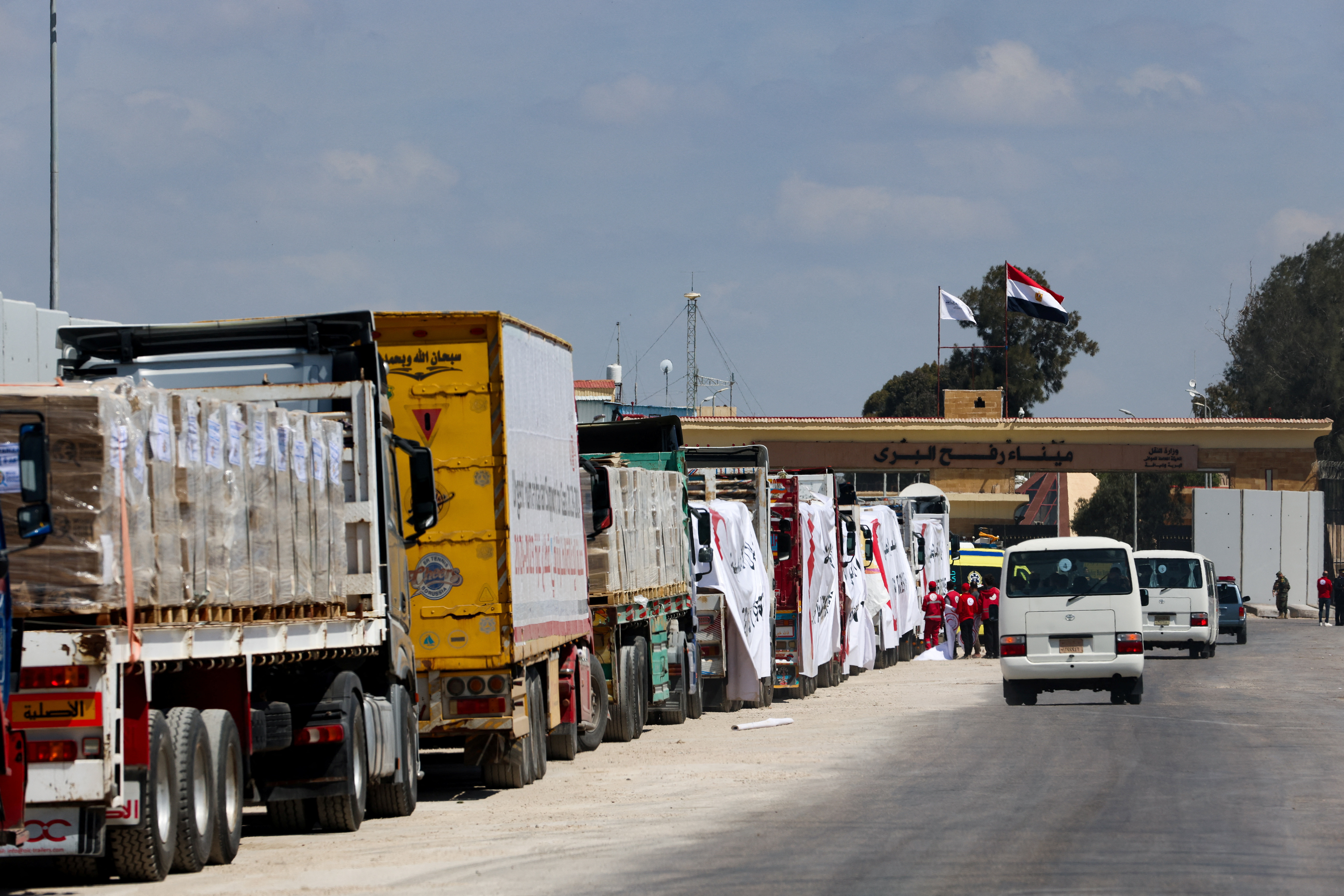 Vehicle line up, near the Rafah border crossing between Egypt and the Gaza Strip, in Rafah